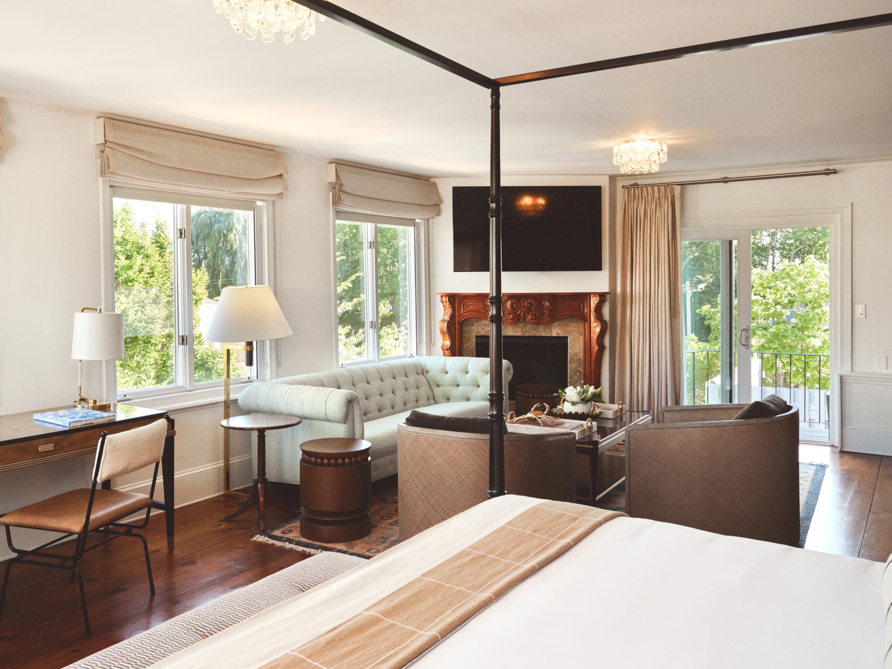 a room with a bed and a fireplace