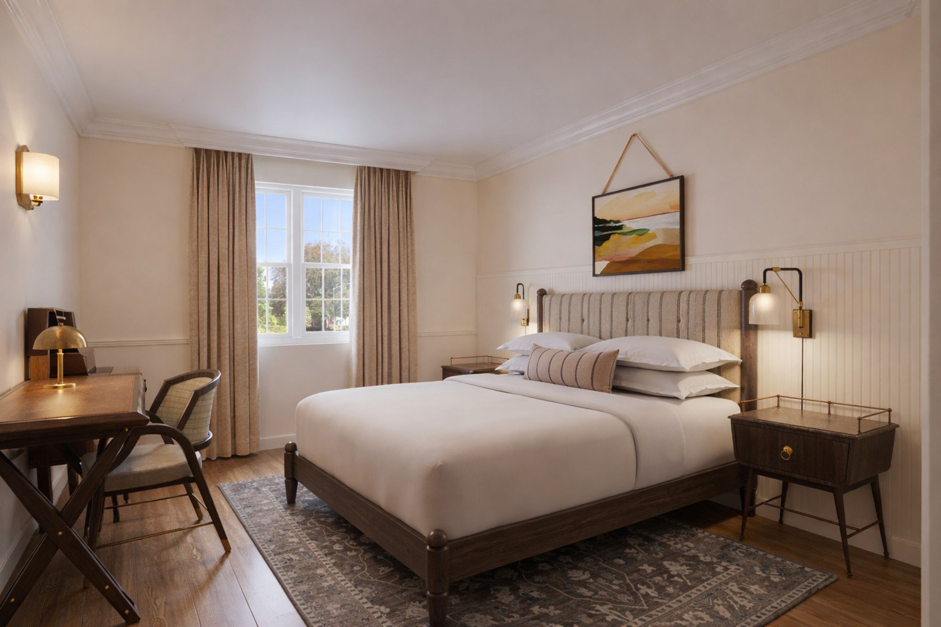 a bedroom with a bed and chairs