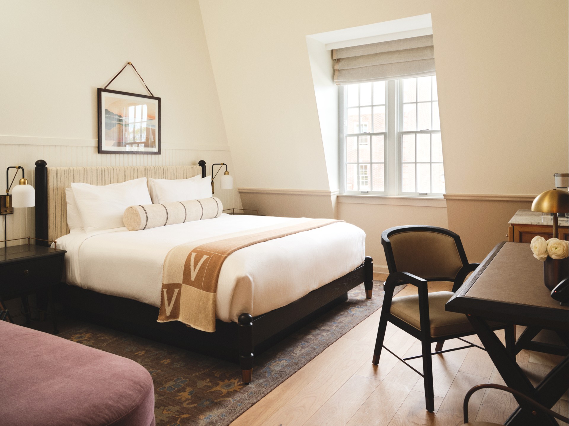 a room with a bed and a desk