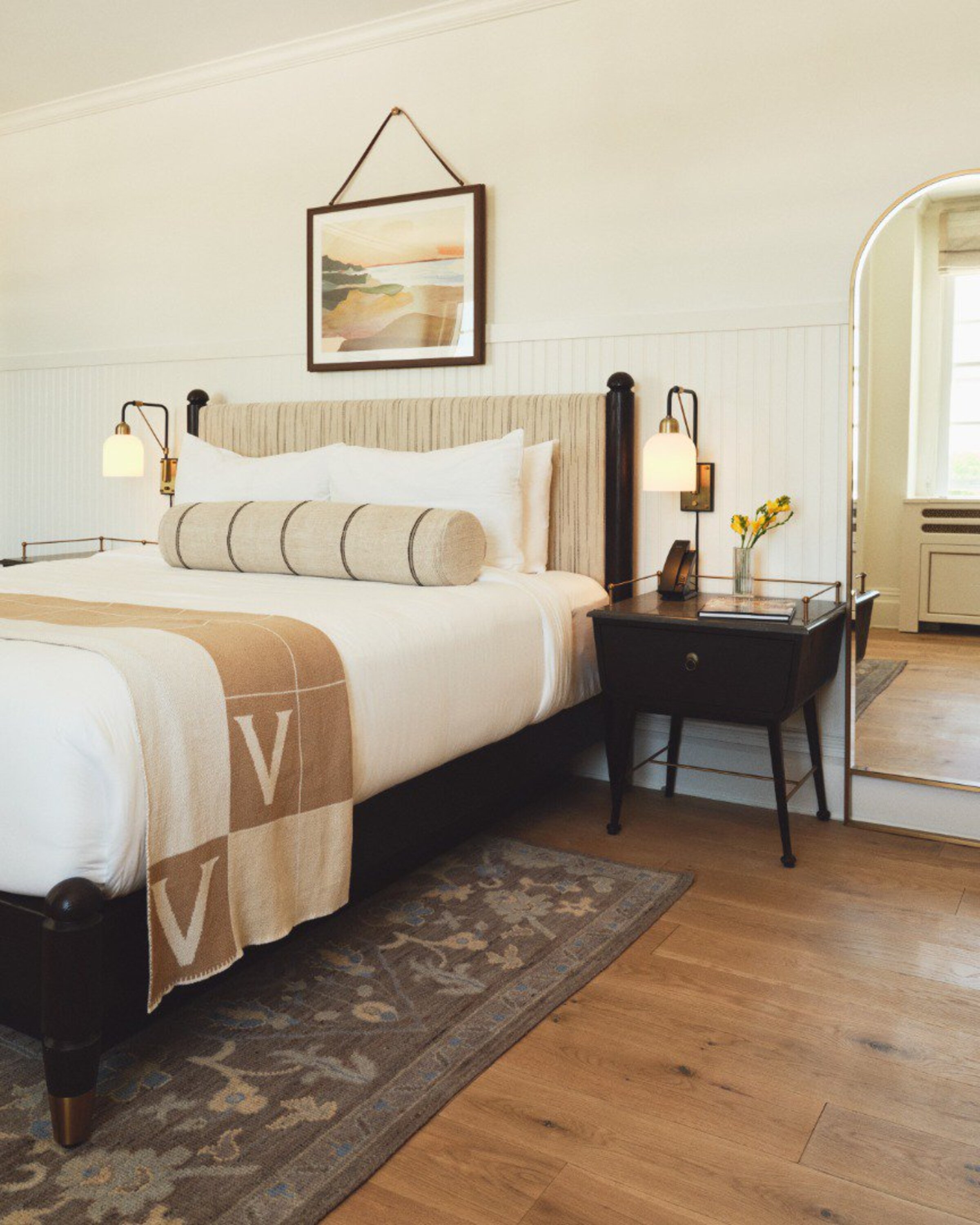a bed with a pillow and a table