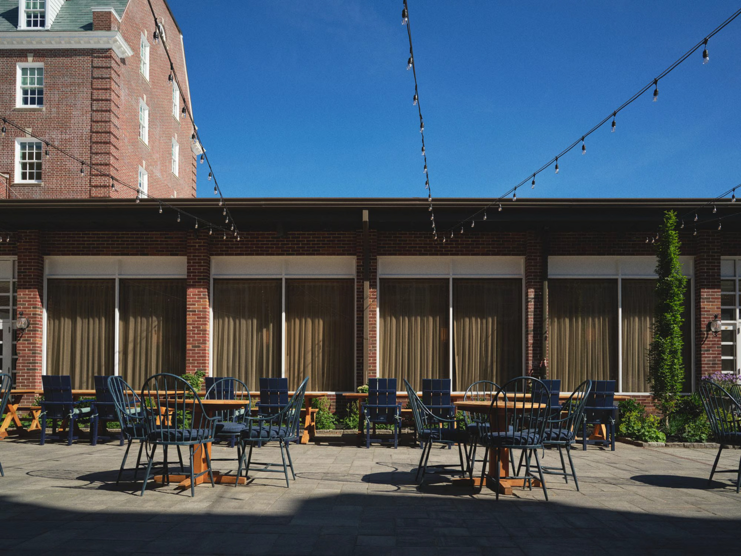 a patio with chairs and tables
