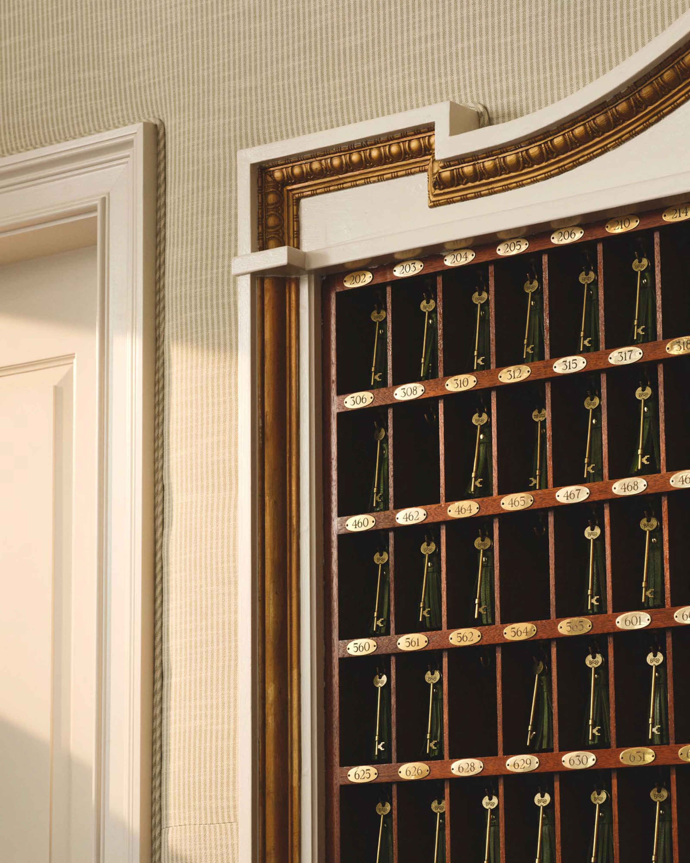 a door with a shelf full of keys