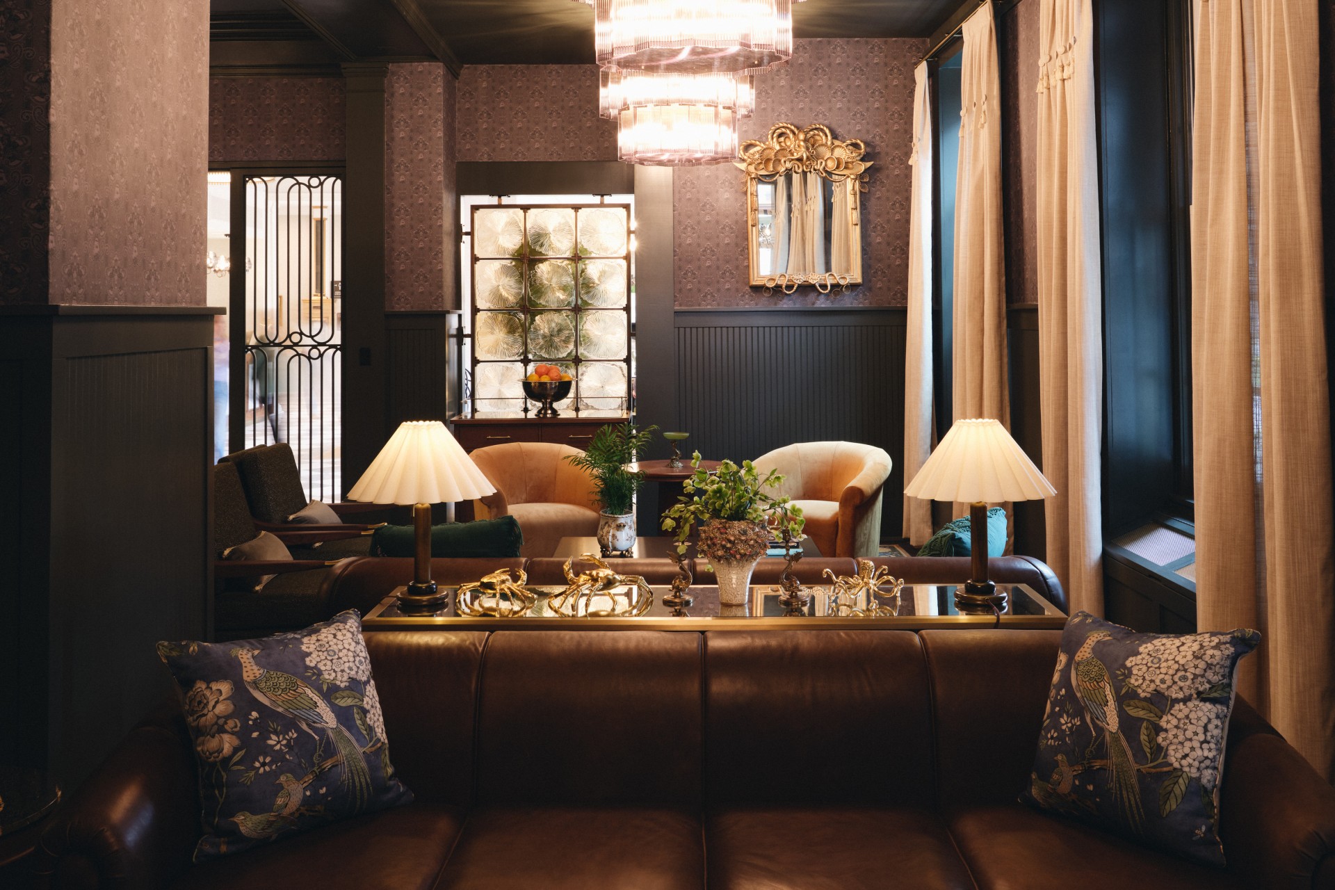 a room with a couch and chairs