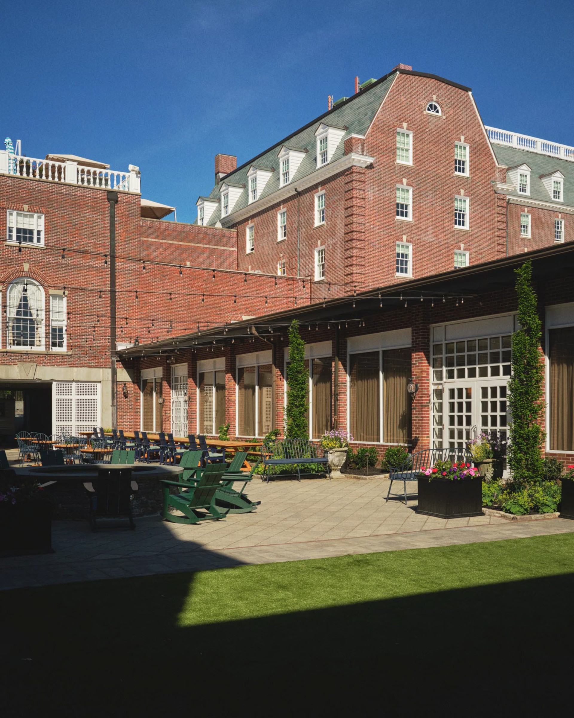 a building with a patio and chairs