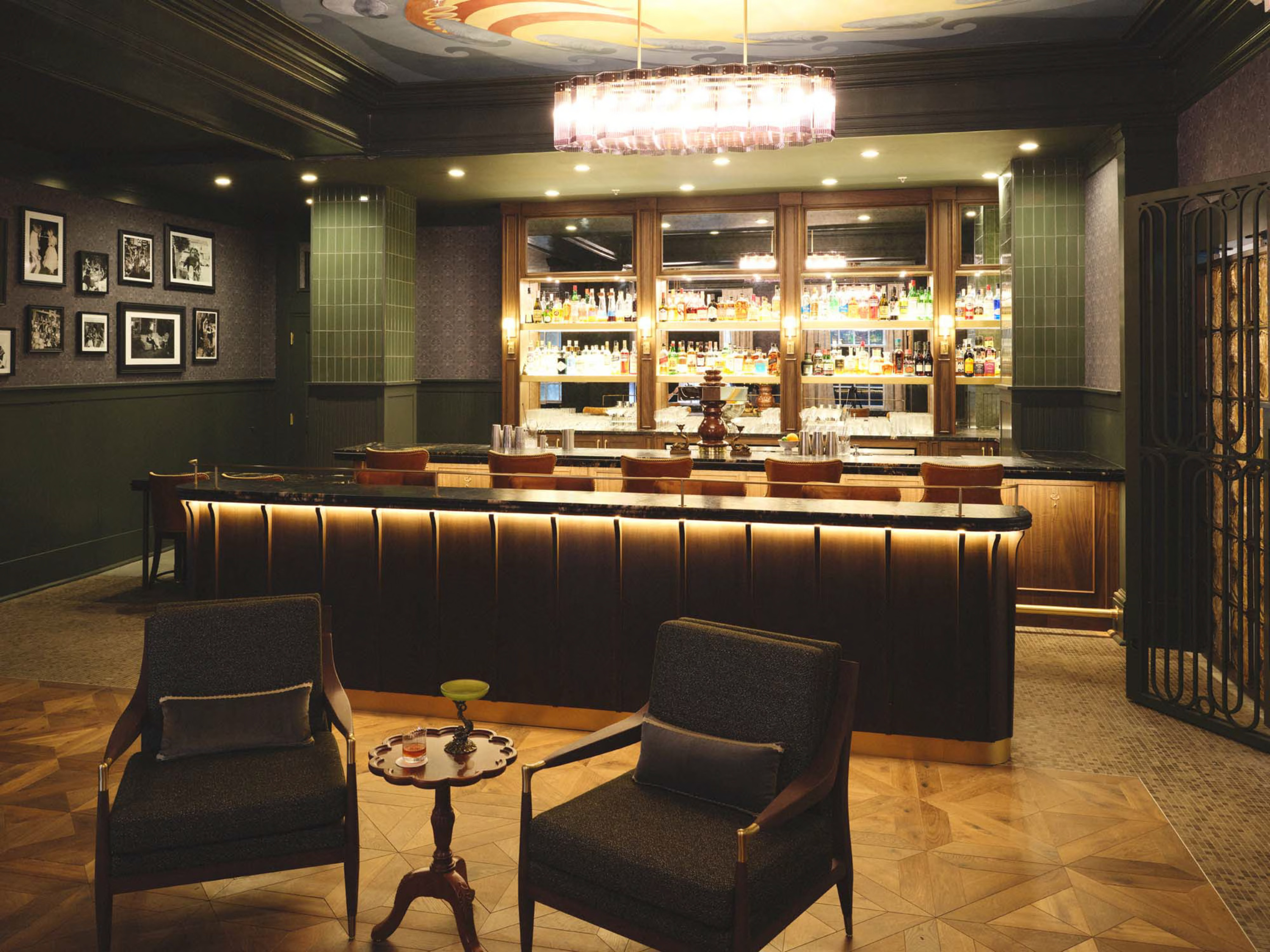 a bar with chairs and a table