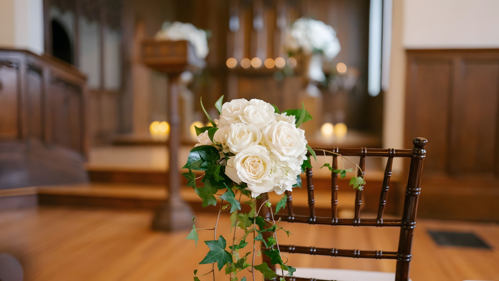 a bouquet of white roses on a chair