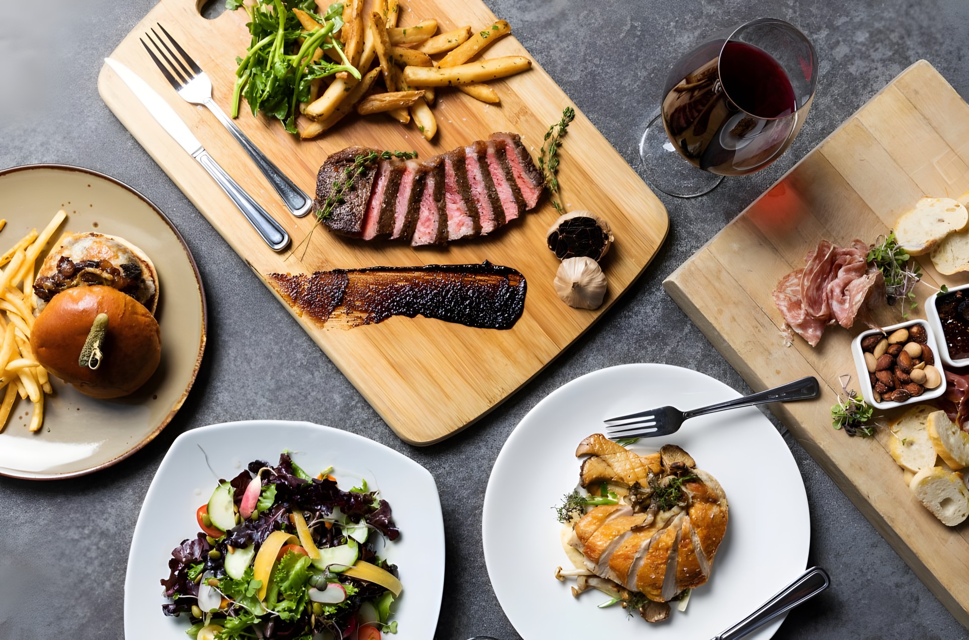 a table with plates of food and wine