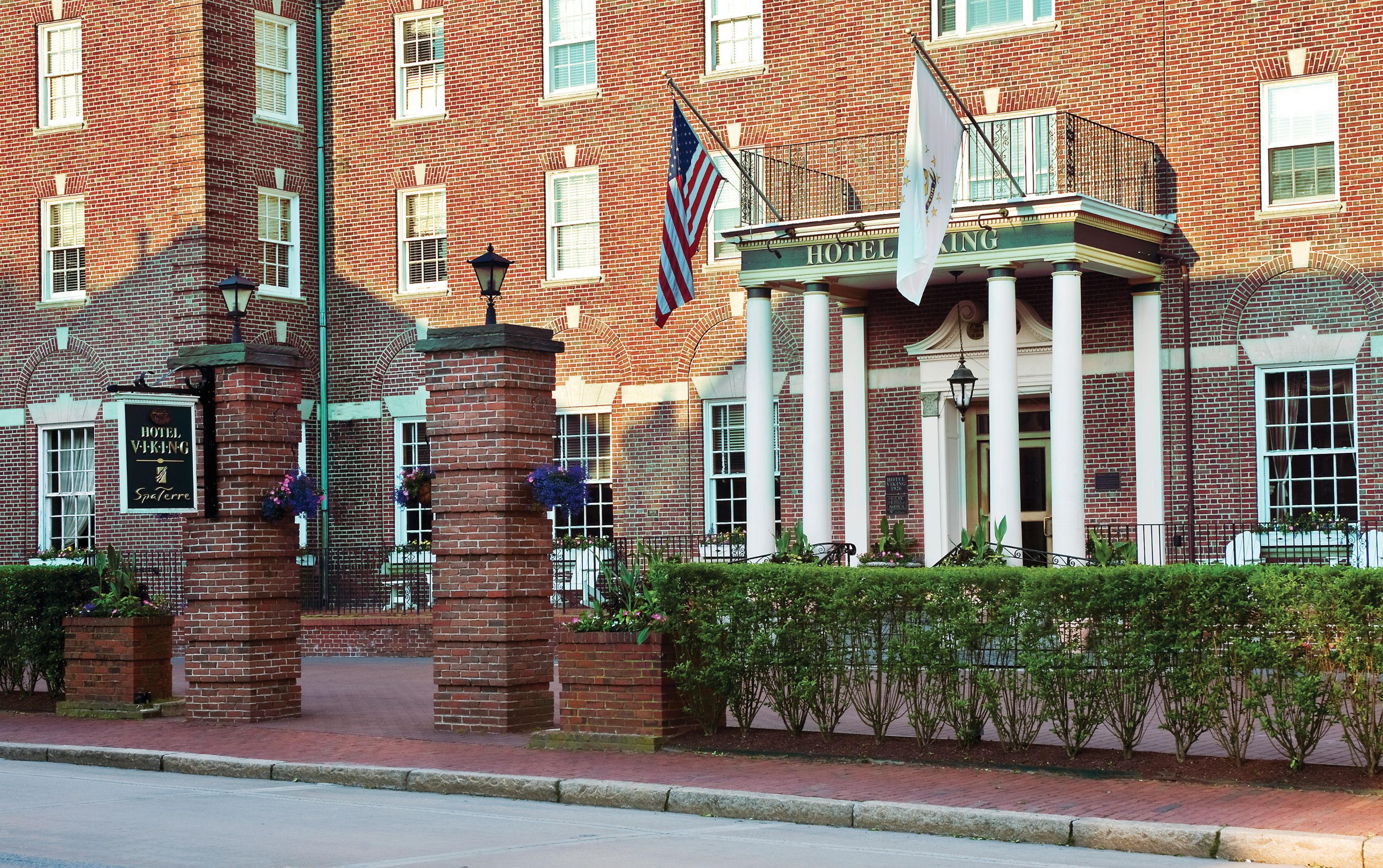 a building with columns and flags