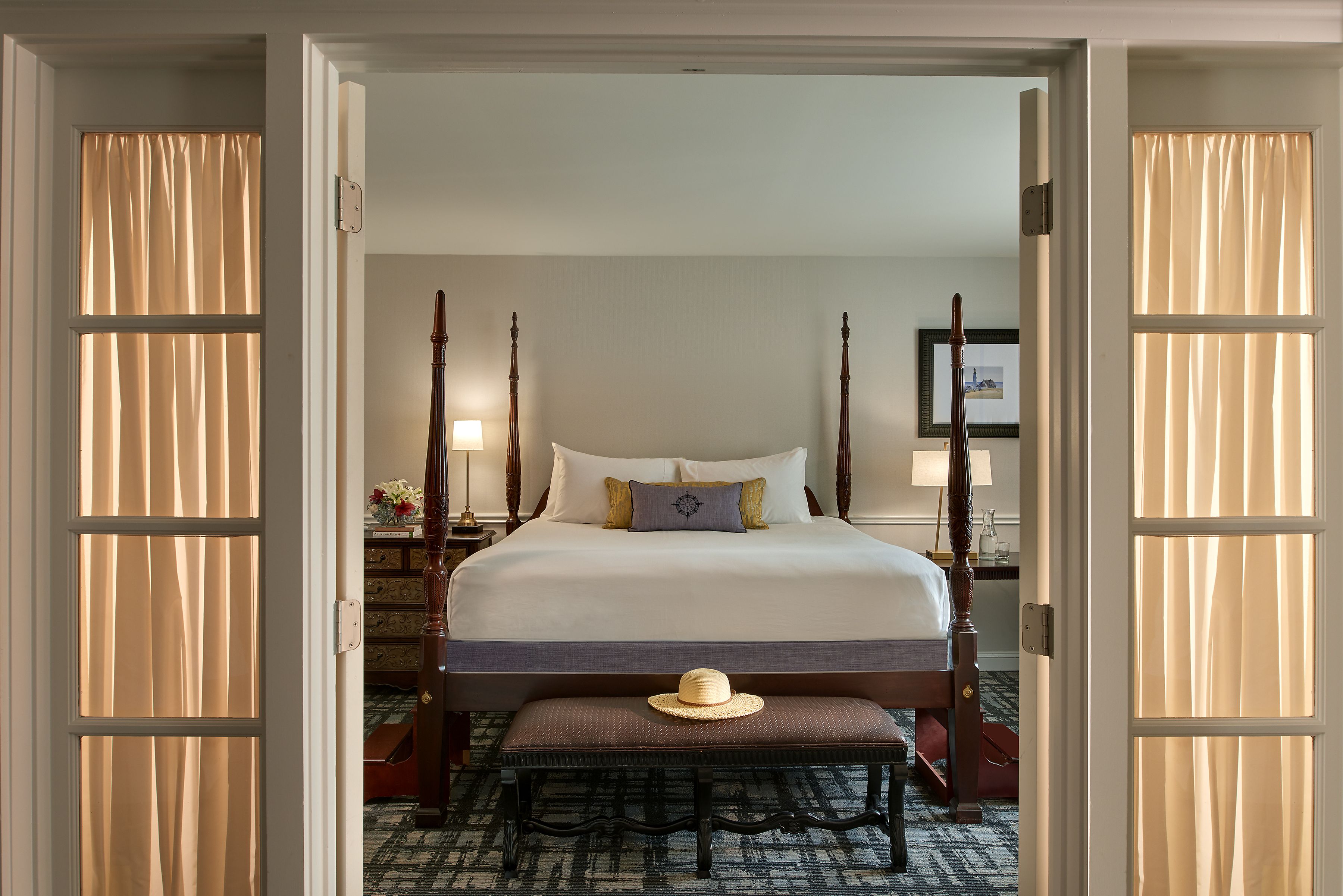 a bedroom with a bed and a bench