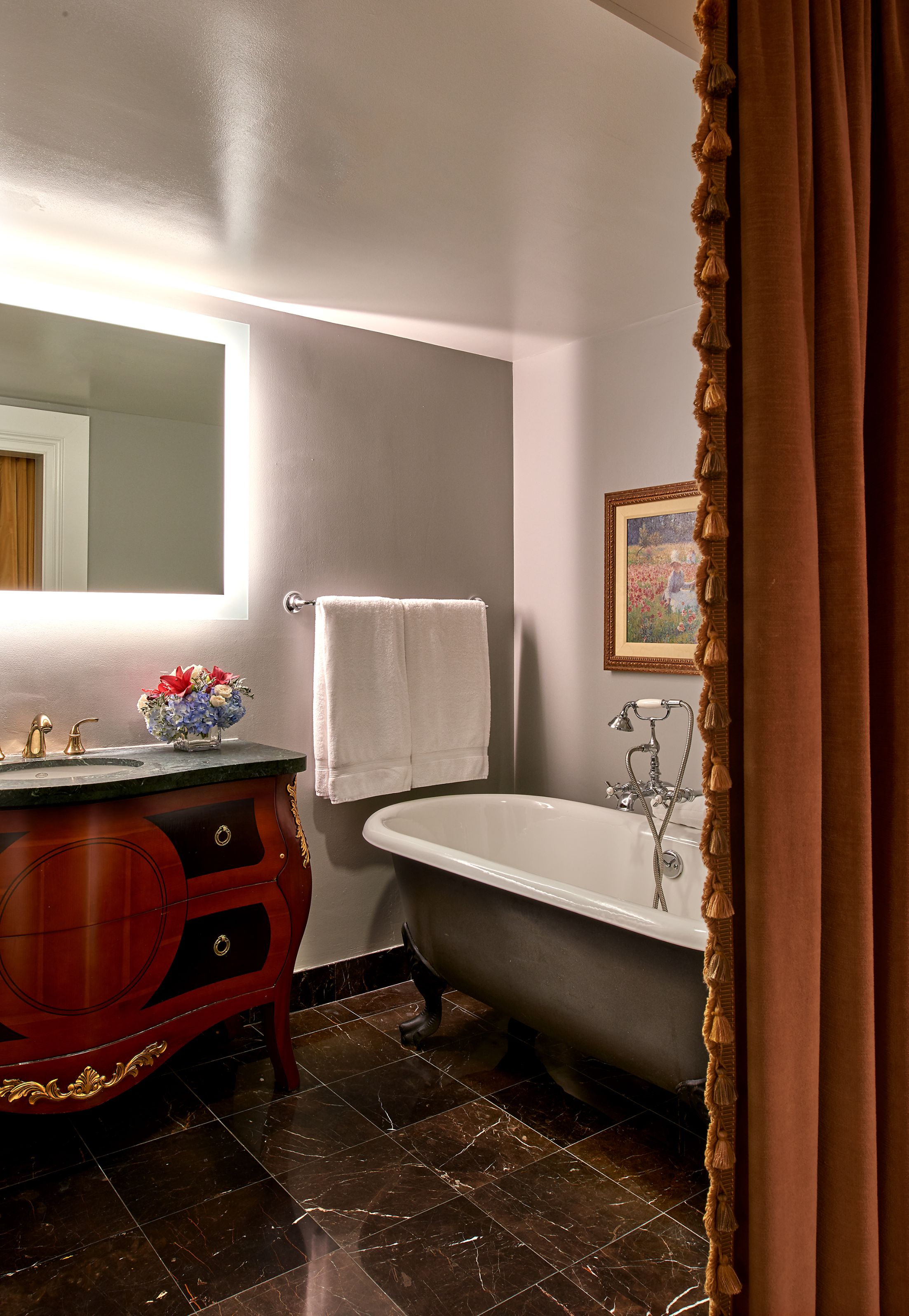 a bathroom with a bathtub and sink