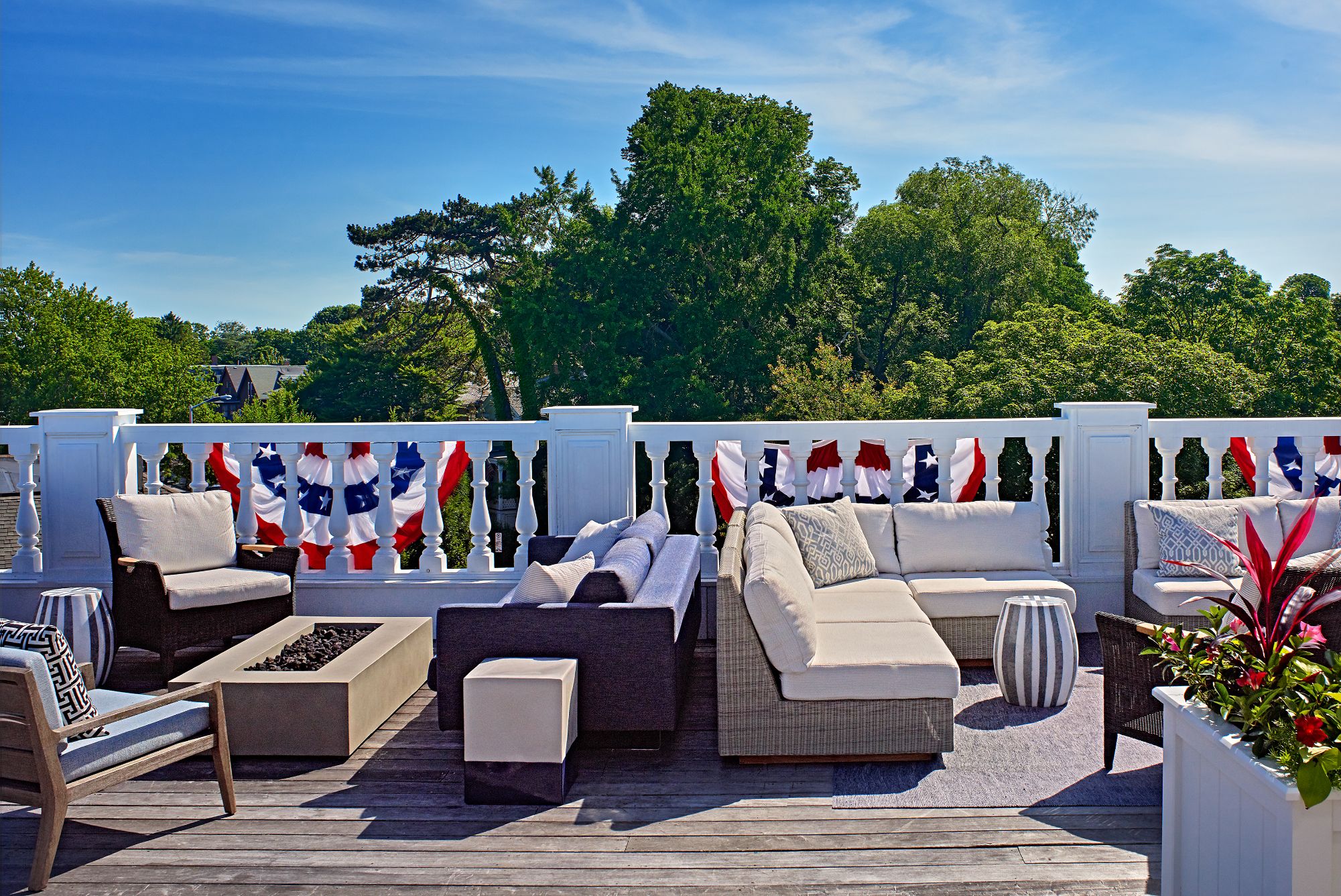 a patio with furniture and a fire pit