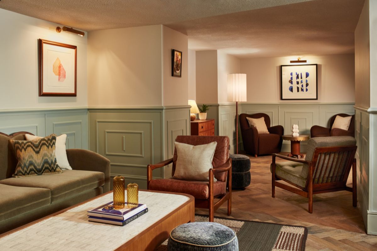 a living room with a couch and chairs
