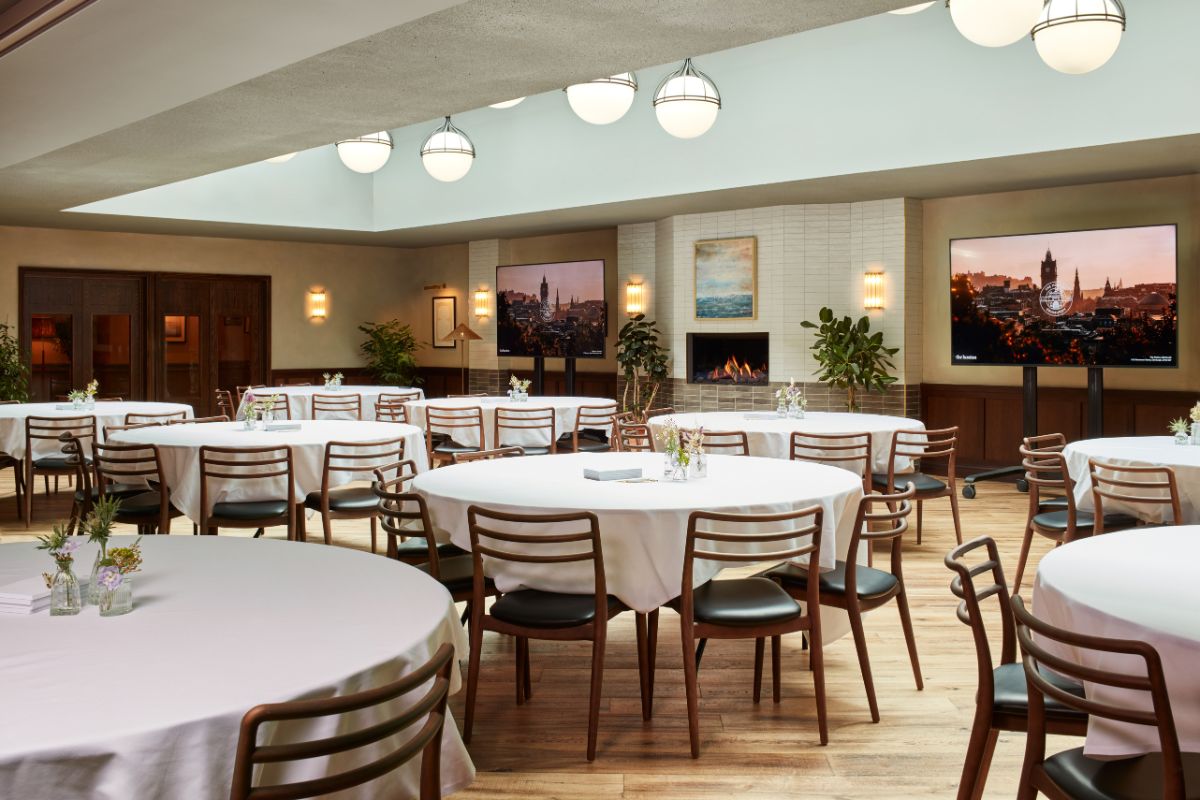 a room with round tables and chairs