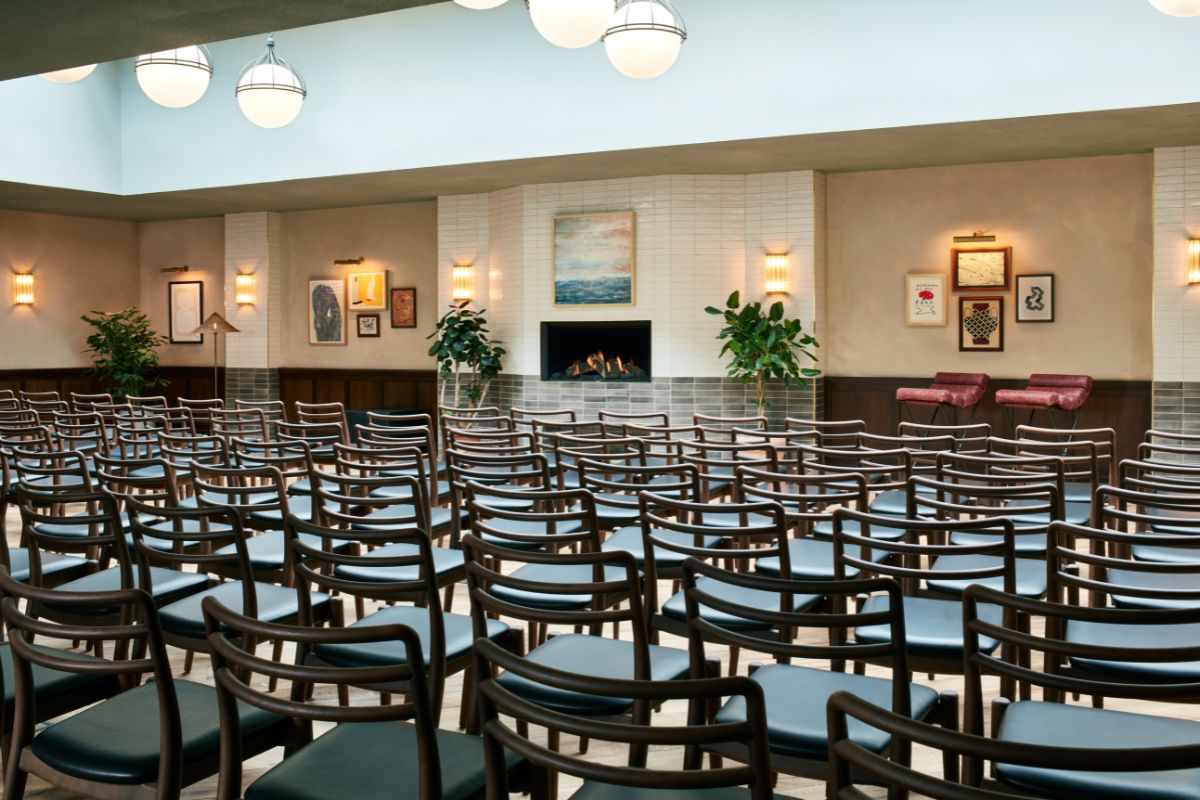 a room with chairs and a fireplace