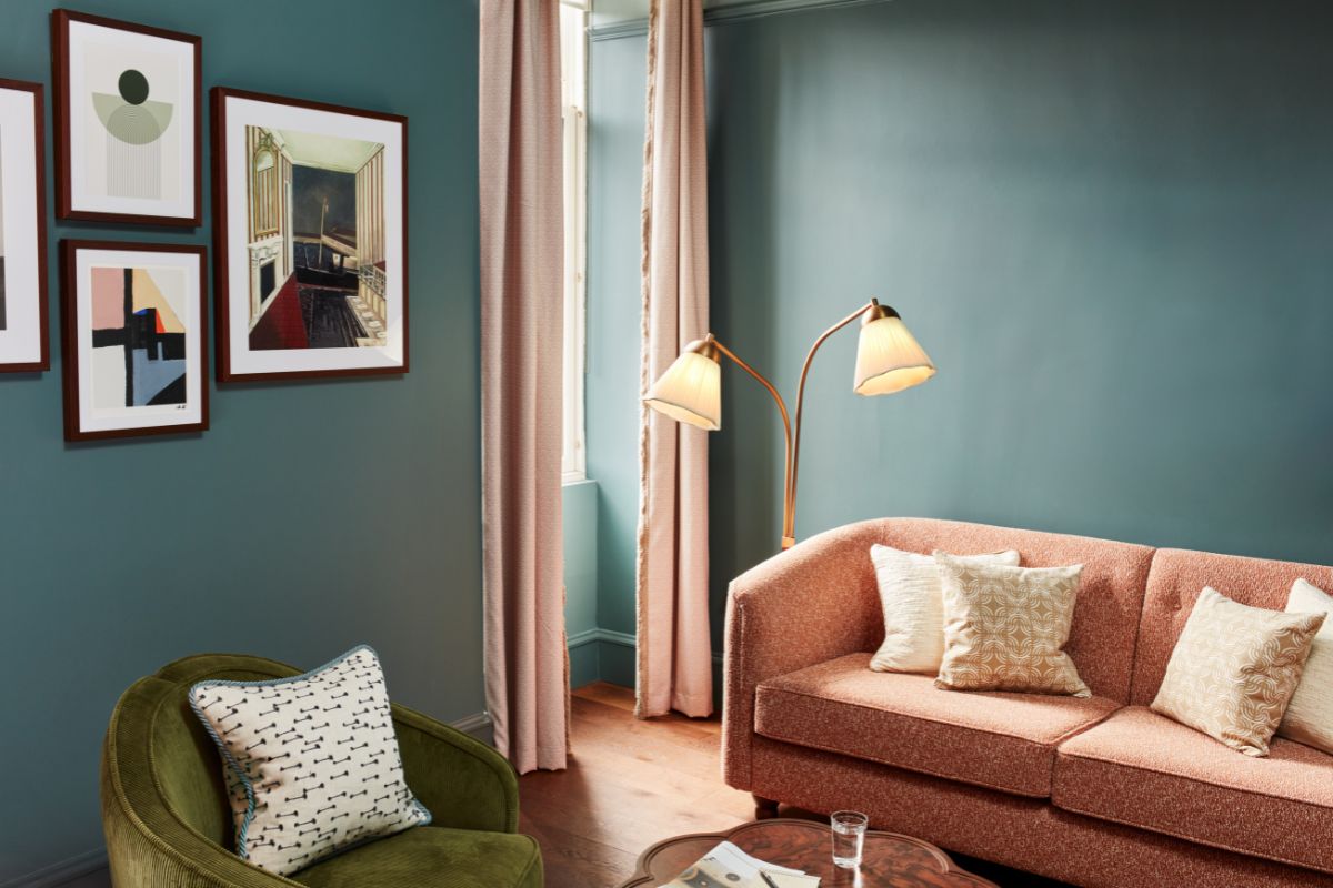 a living room with a couch and a lamp