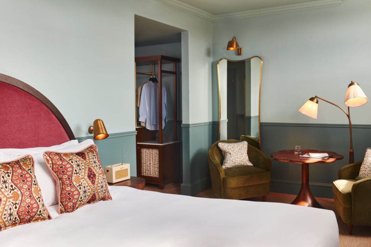 a room with a bed and a mirror