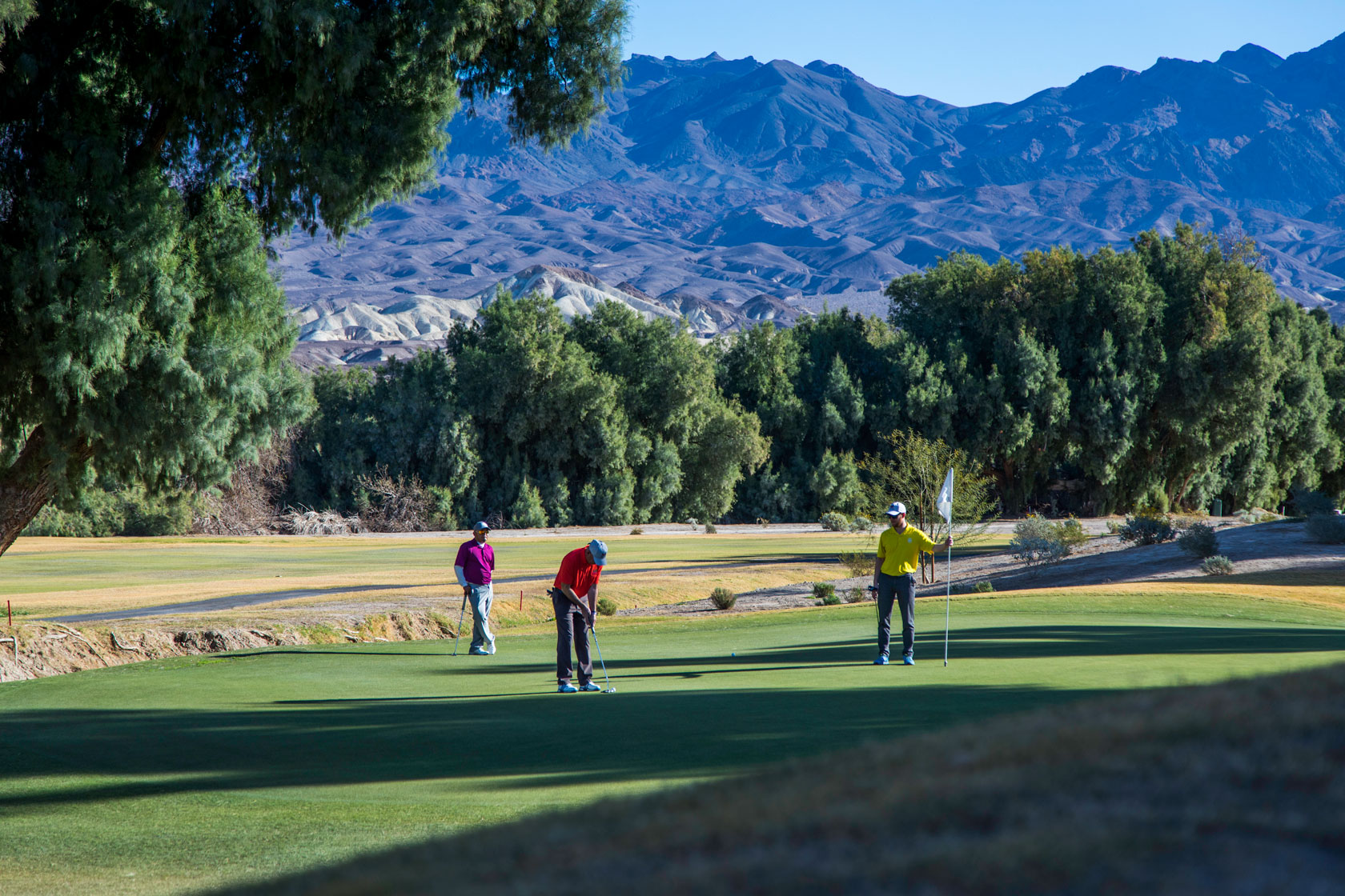 a group of people on a golf course