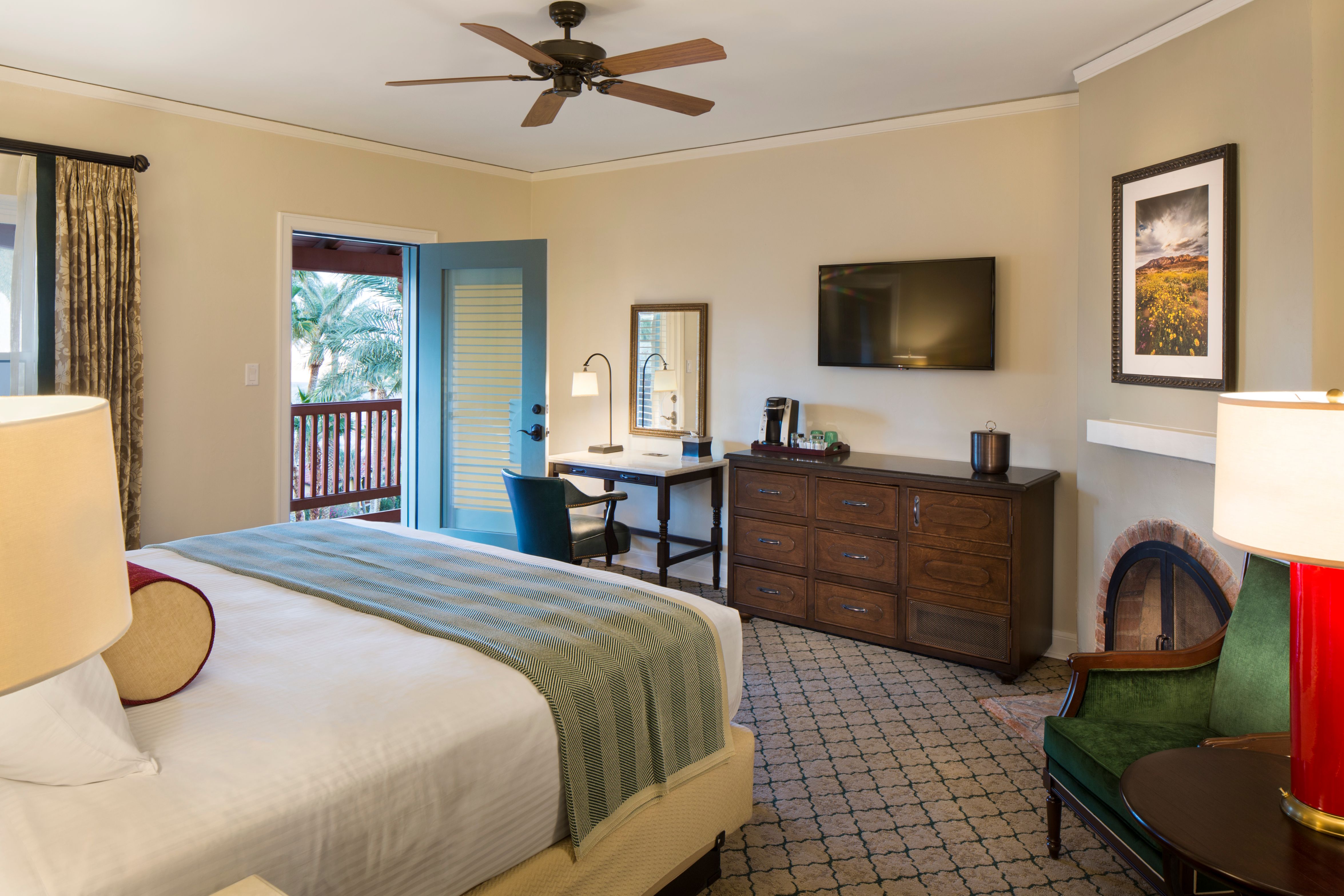 a room with a bed and a television