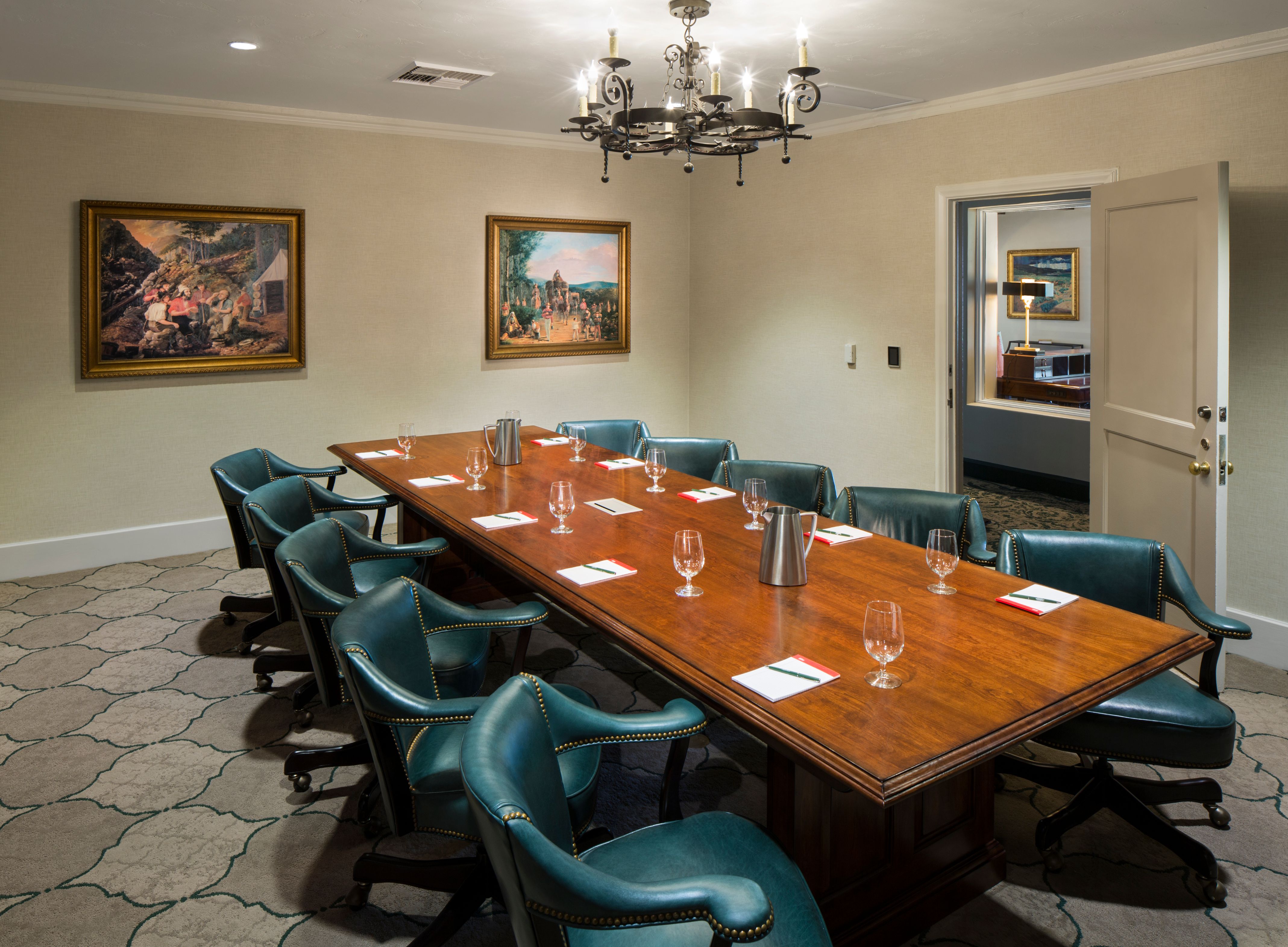 a conference room with a long table and chairs