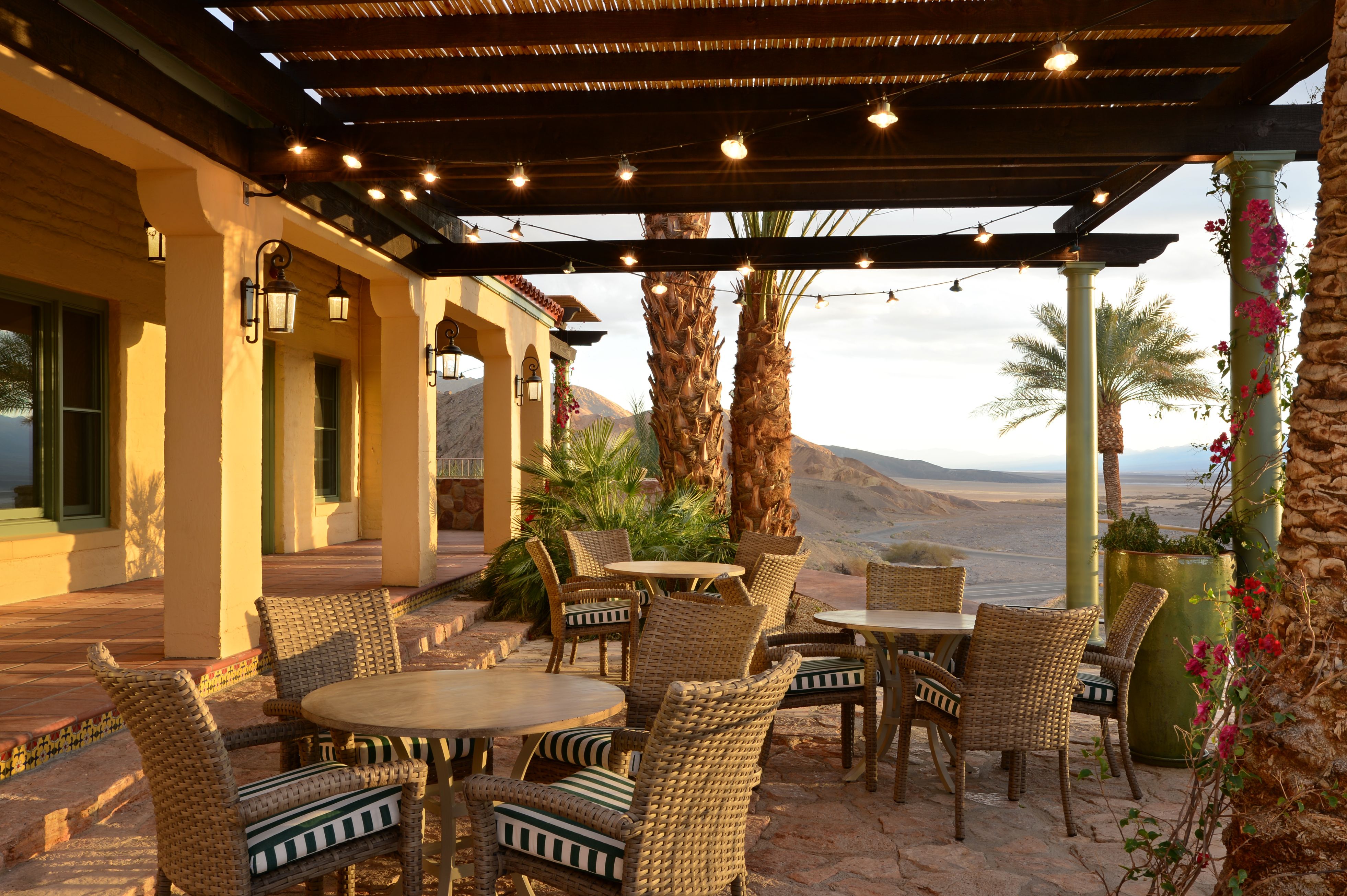 a patio with chairs and tables