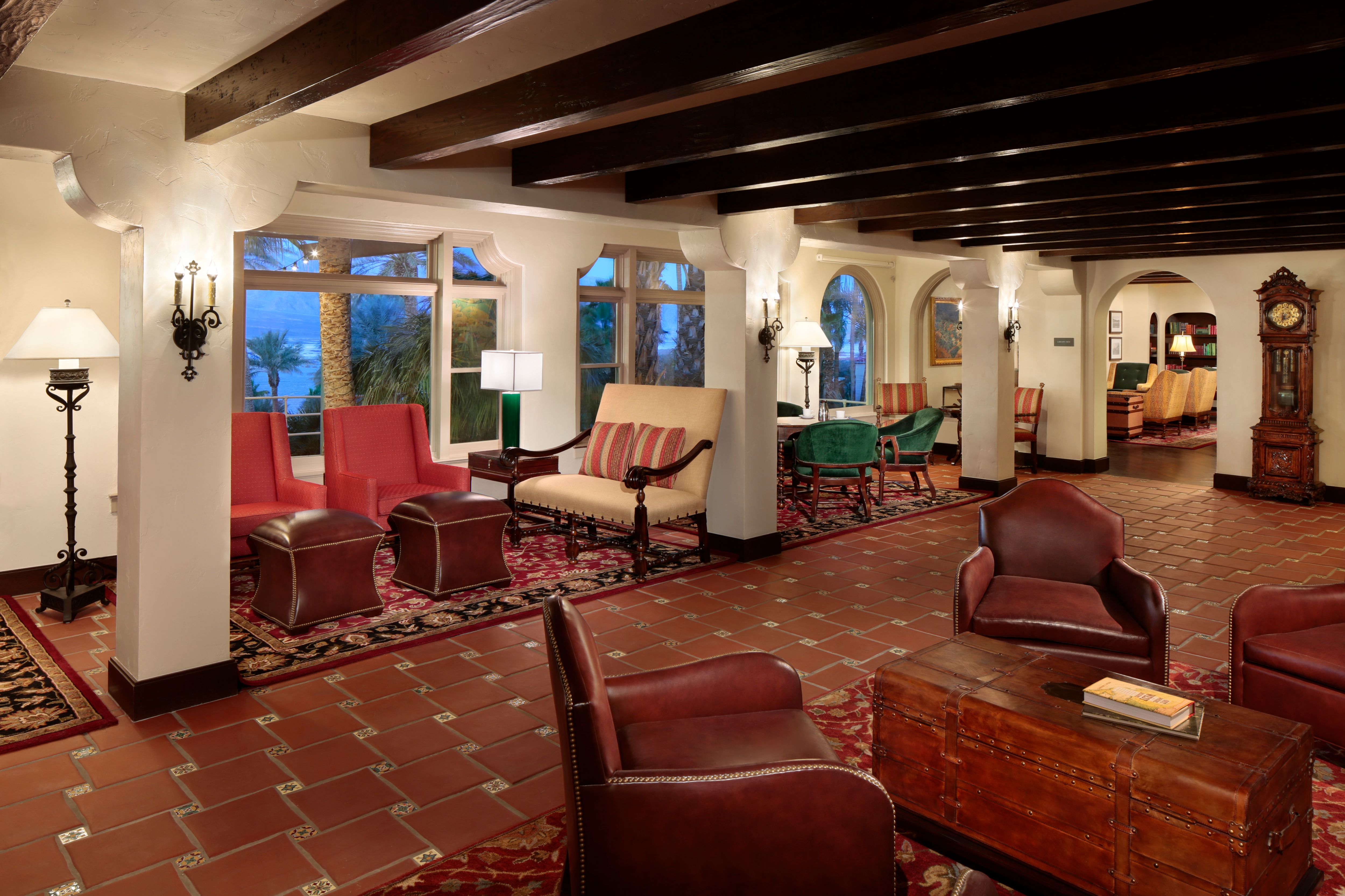 a room with a large area with chairs and a table
