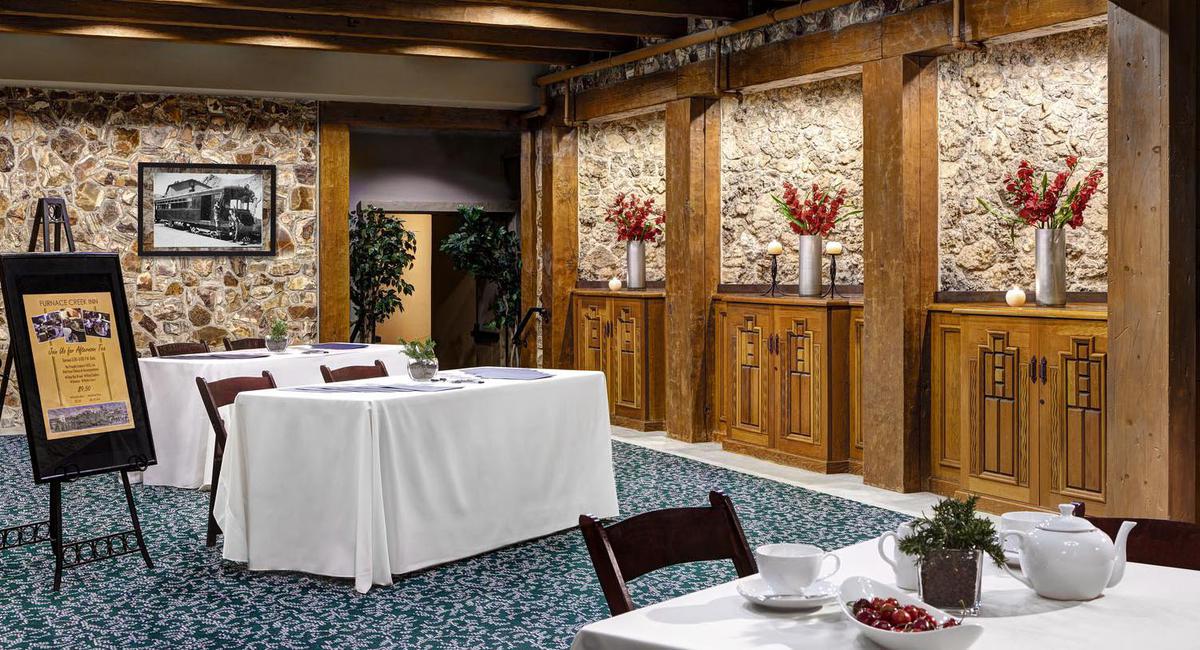 a room with a table and chairs