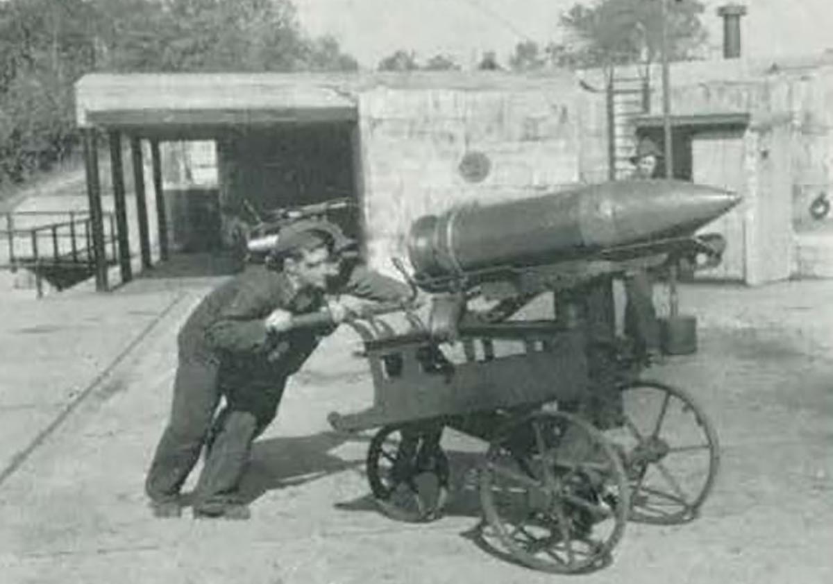 a man pushing a cannon