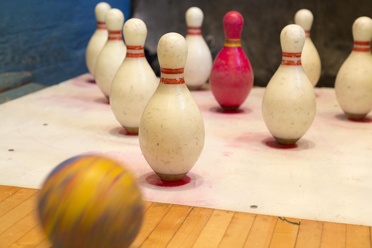 a bowling ball and pins on a table