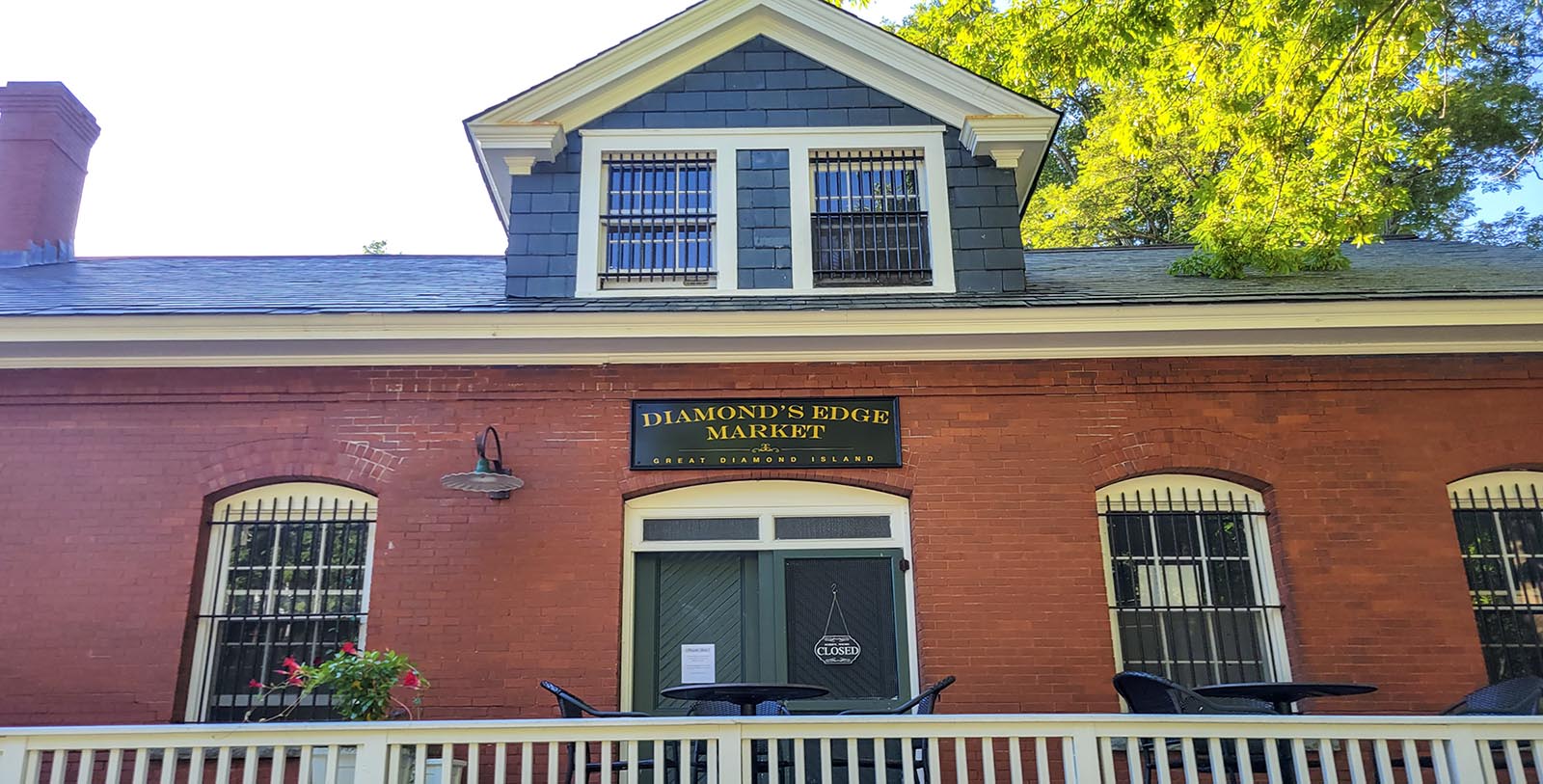 a brick building with a sign on the front
