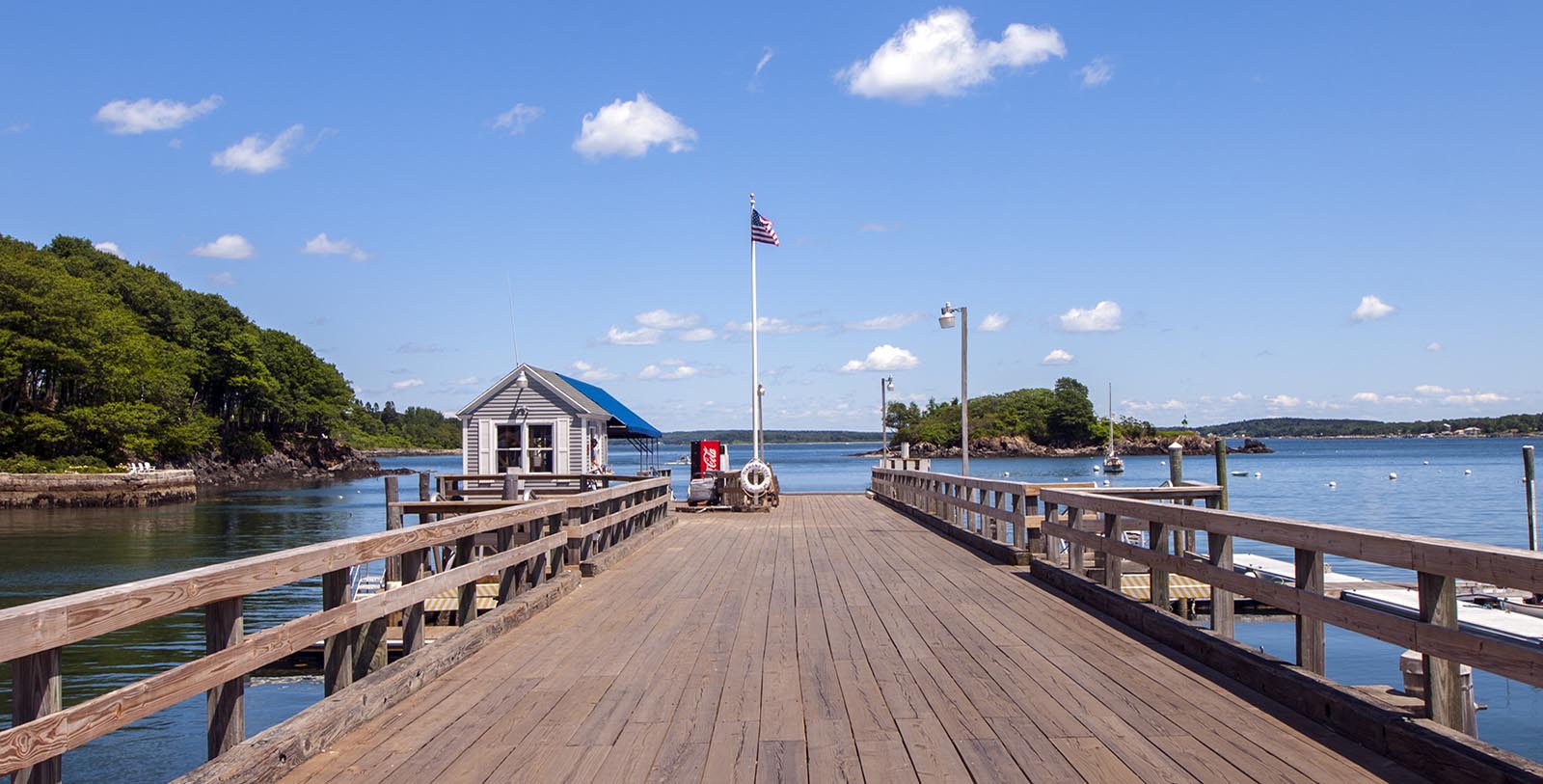 a wooden dock with a flag on it