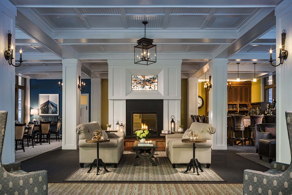 a room with a fireplace and couches