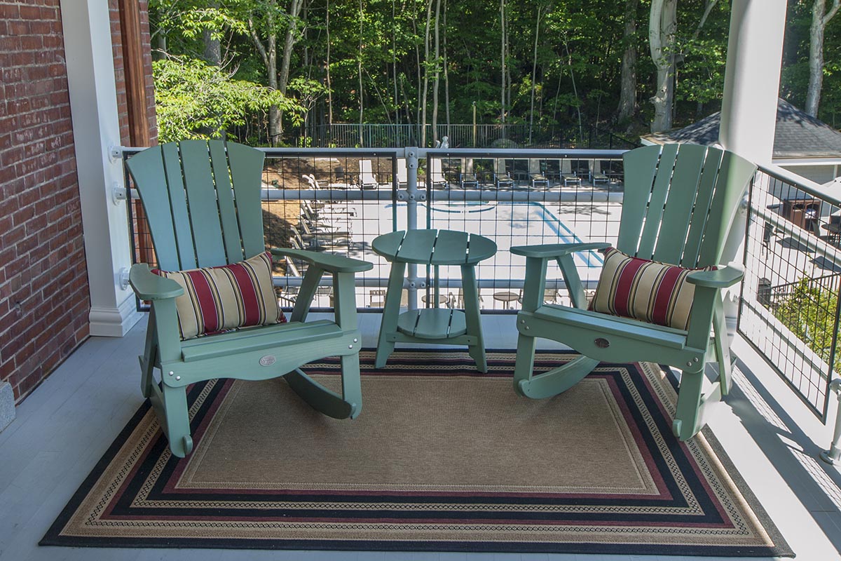 a chair and table on a porch