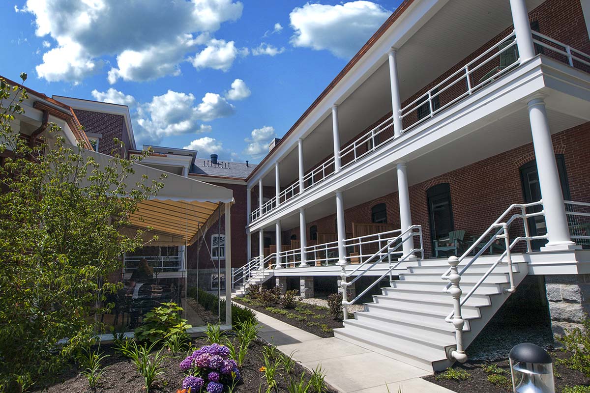 a building with white pillars and stairs