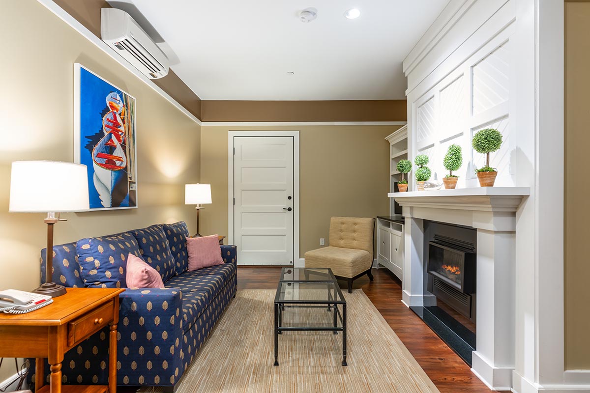 a living room with a fireplace and a couch