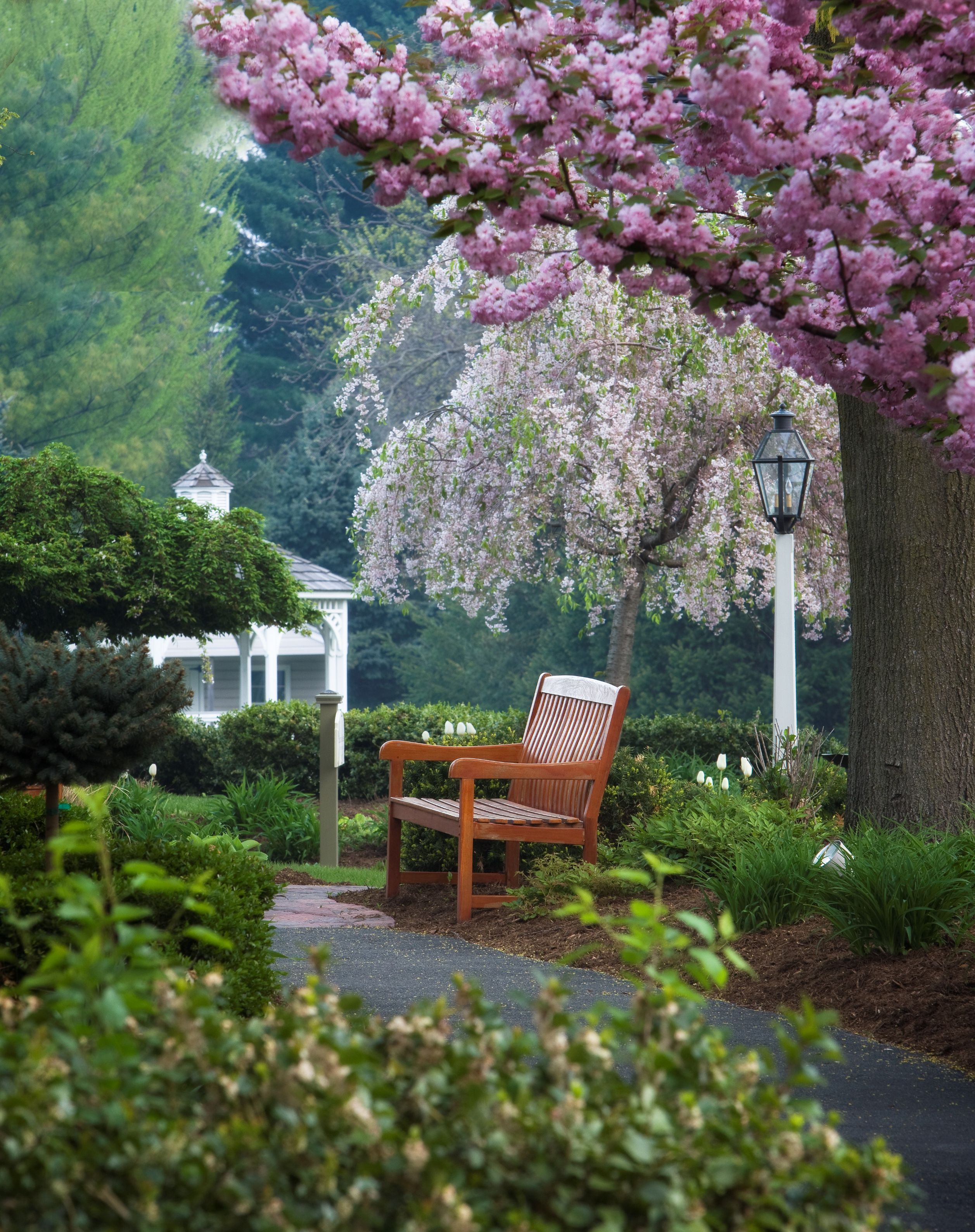 image of gardens with path and bench inn at leola village est_ 1867 pennsylvania_high