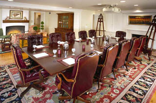 a conference room with a table and chairs