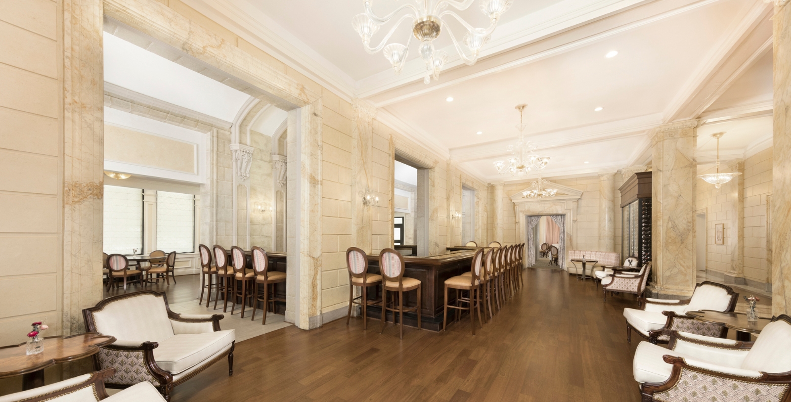 a room with a long table and chairs