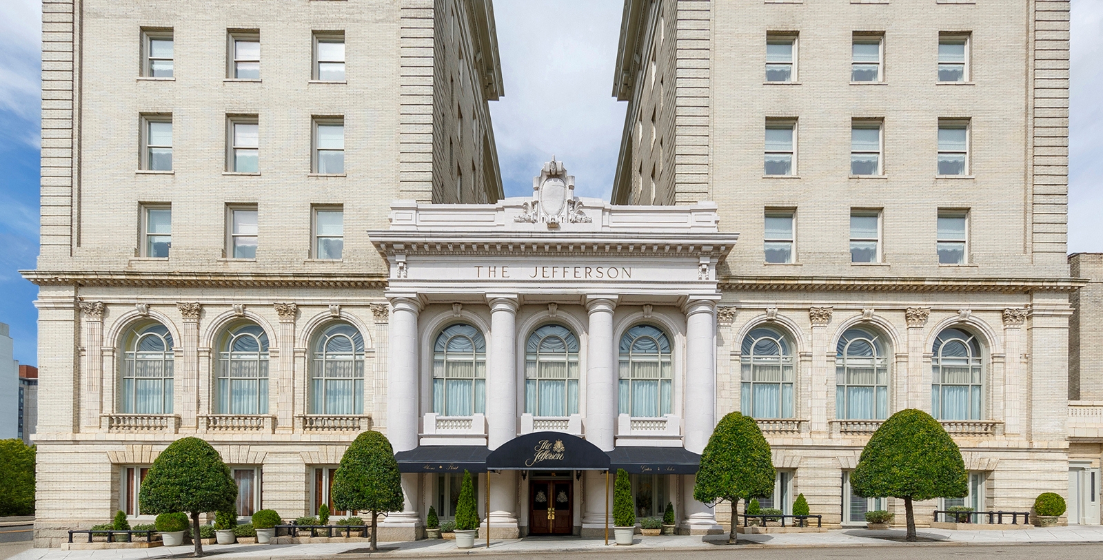 a building with columns and a sign