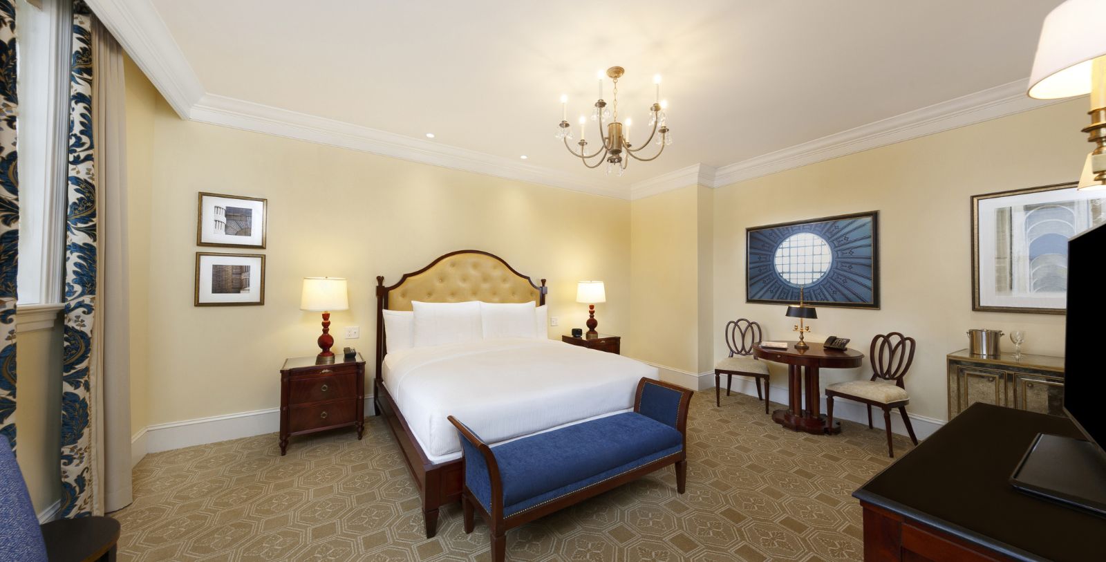 a bedroom with a bed and a table