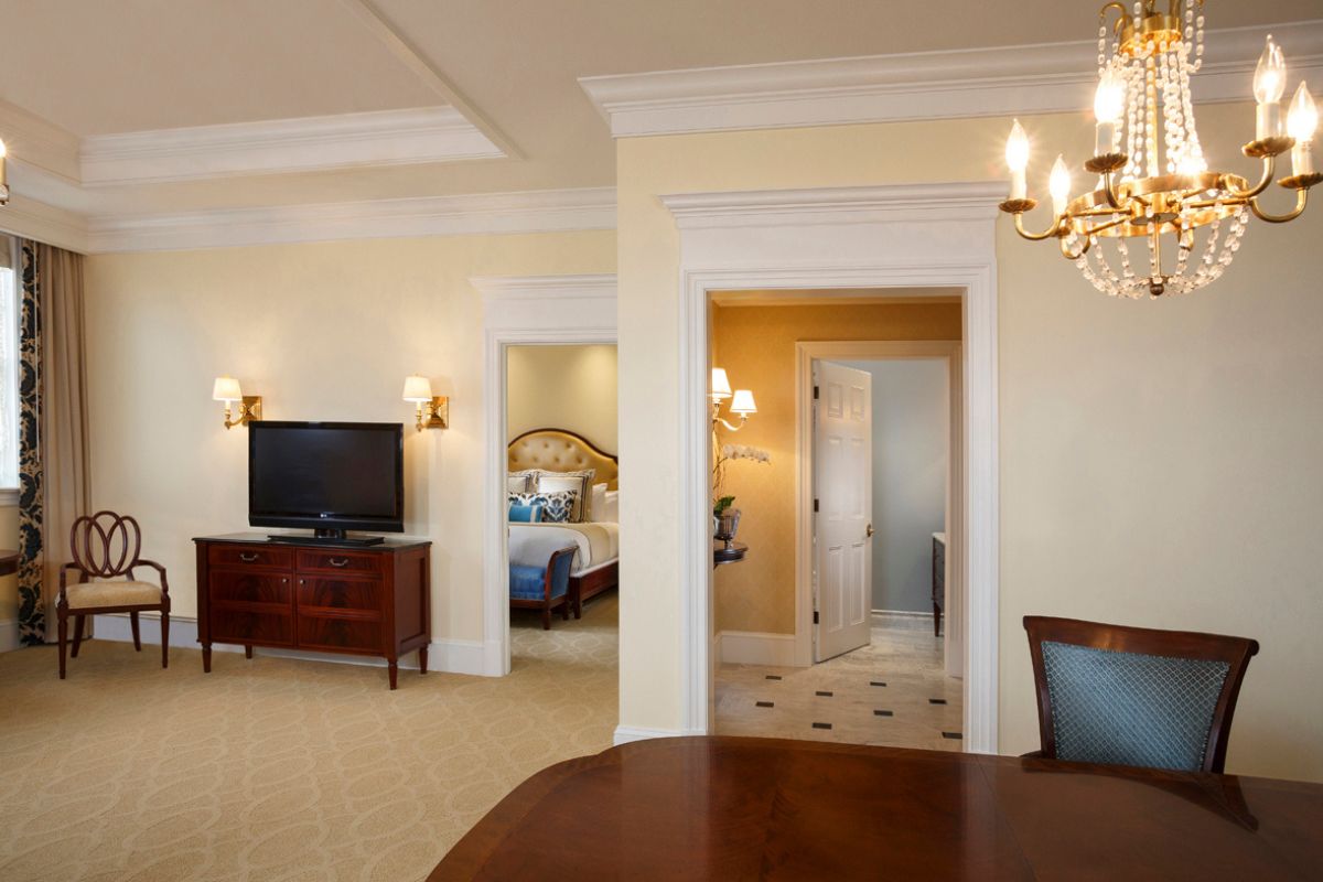 a room with a television and a bed