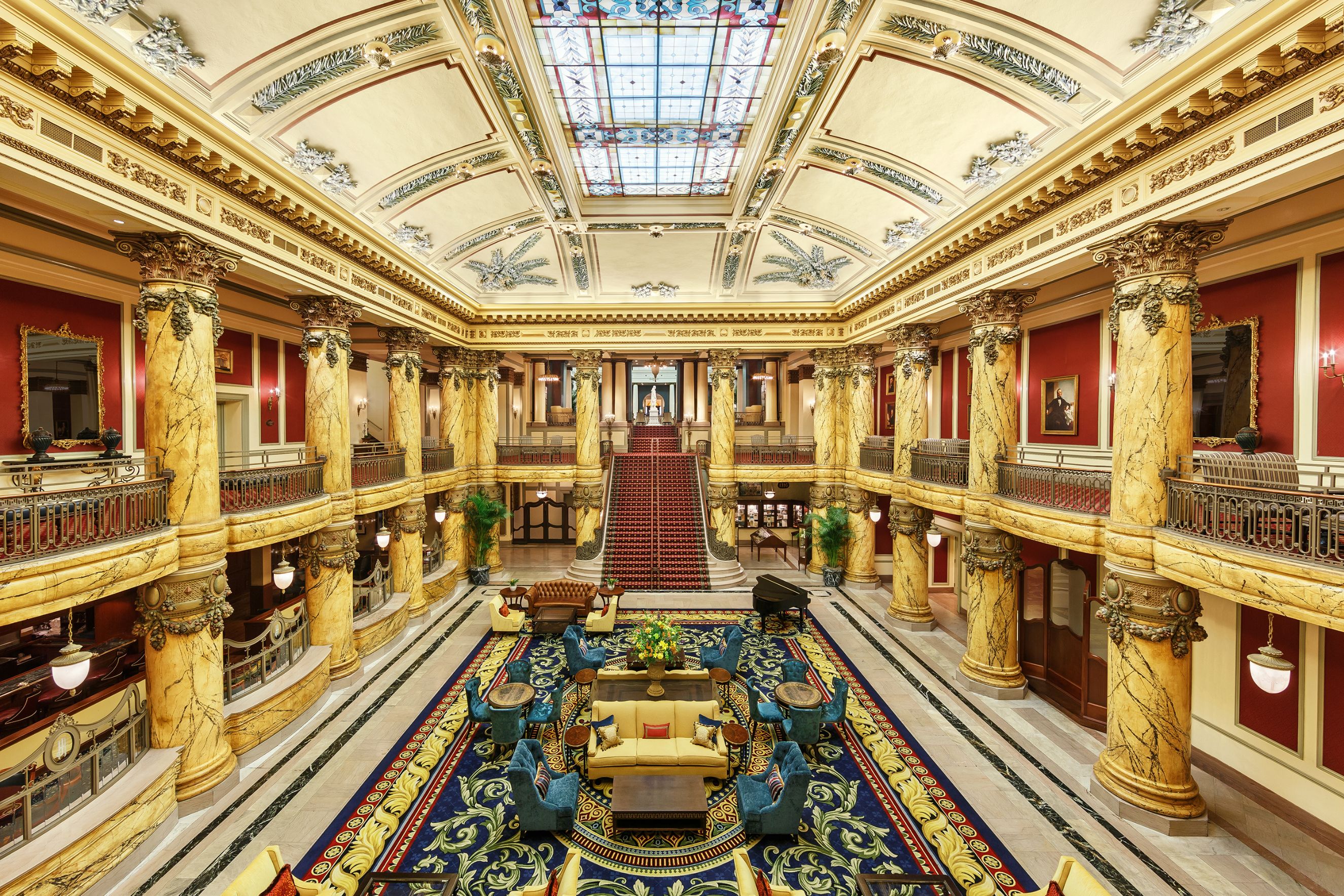 a large building with columns and a large carpet