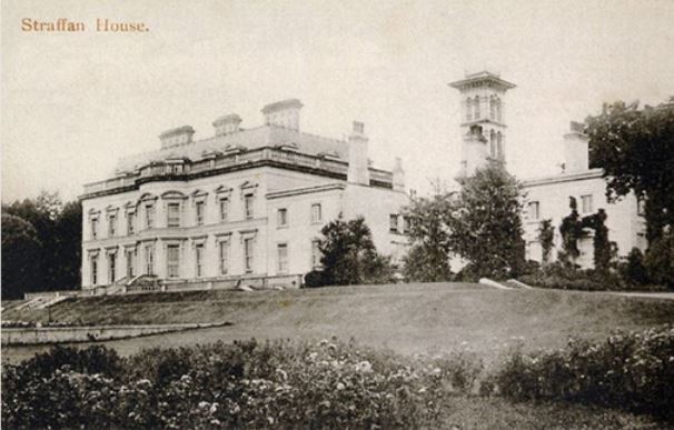 a large white building with a tower