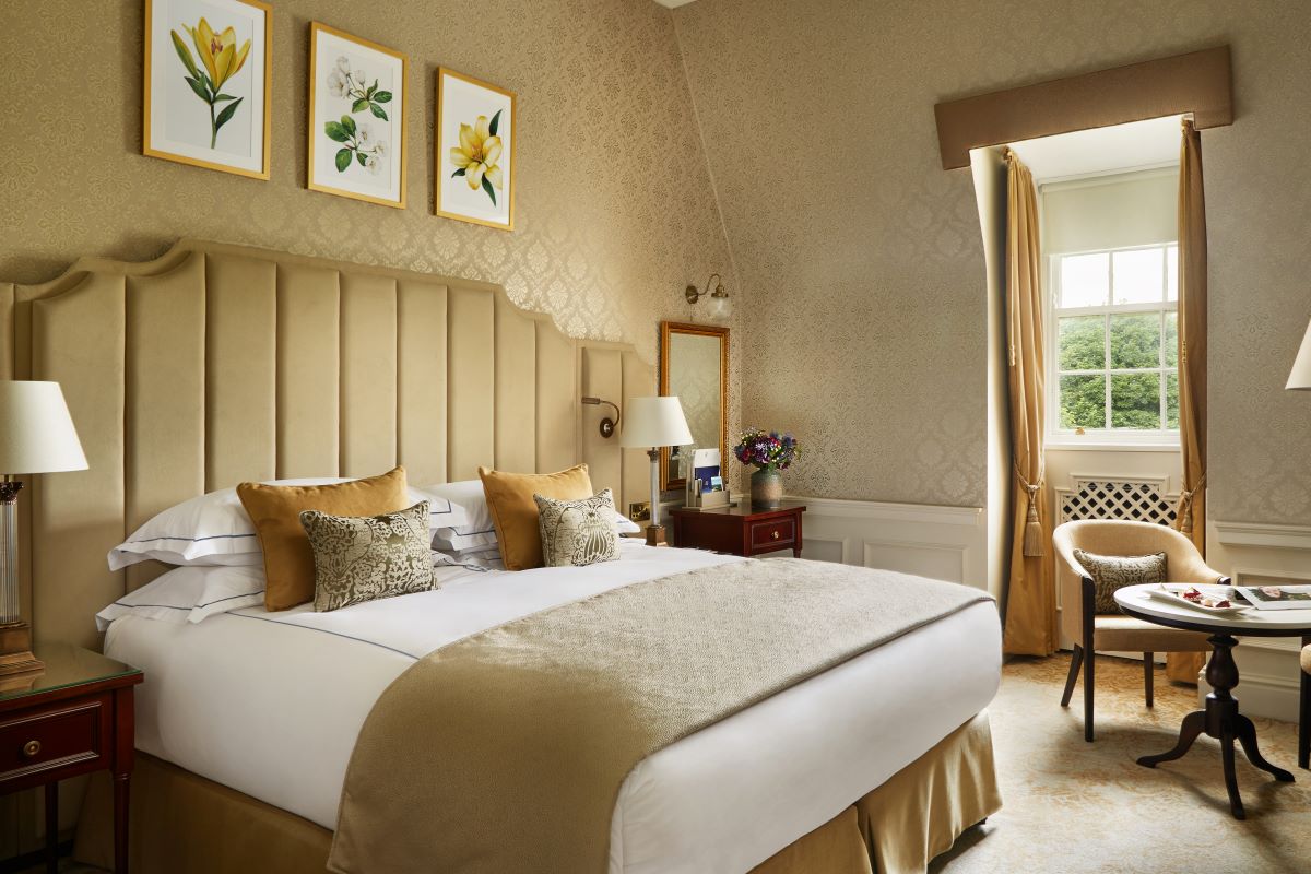 a bedroom with a bed and a chair