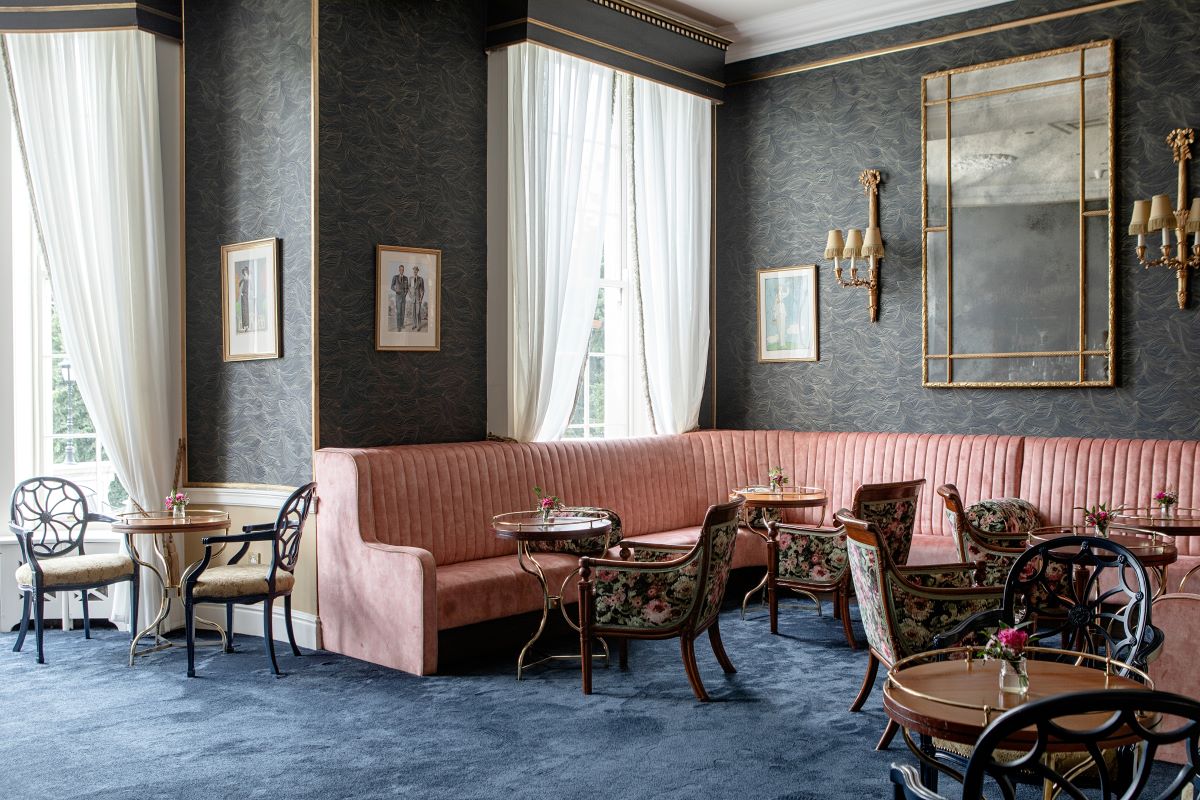 a room with a couch and tables
