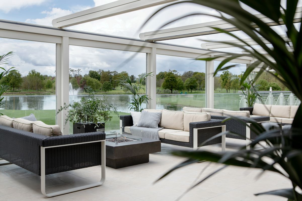a patio with a pool and a fountain