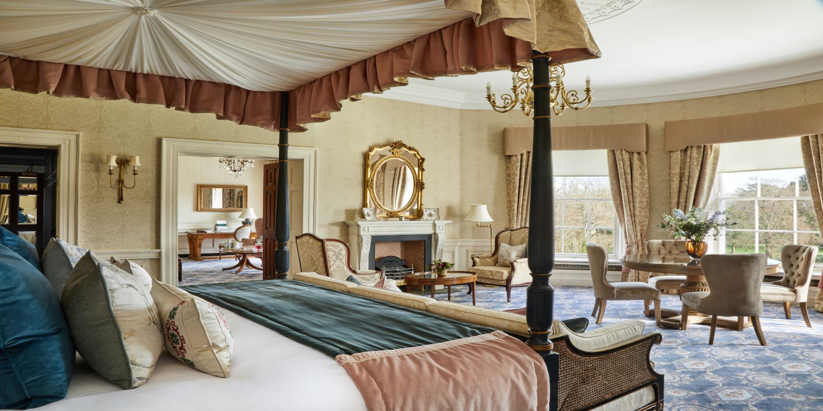 a room with a bed and a fireplace