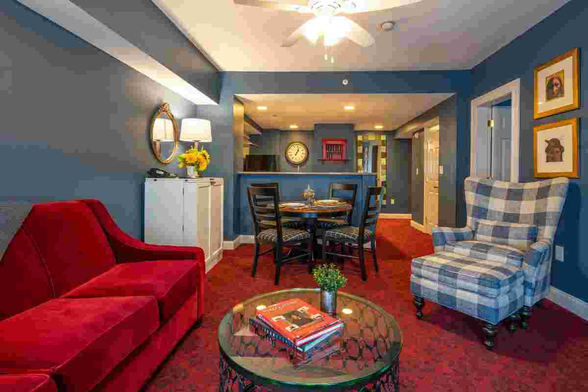 a living room with a table and chairs