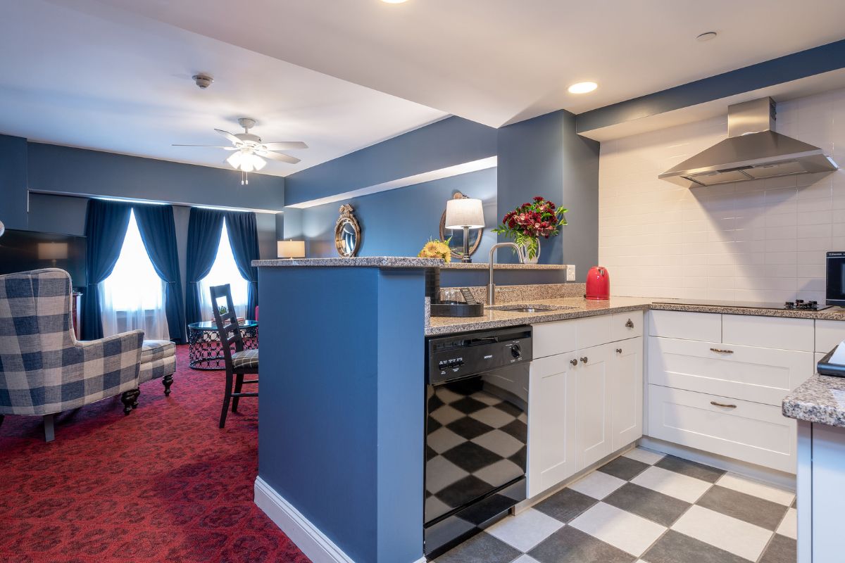 a kitchen with a black and white counter top