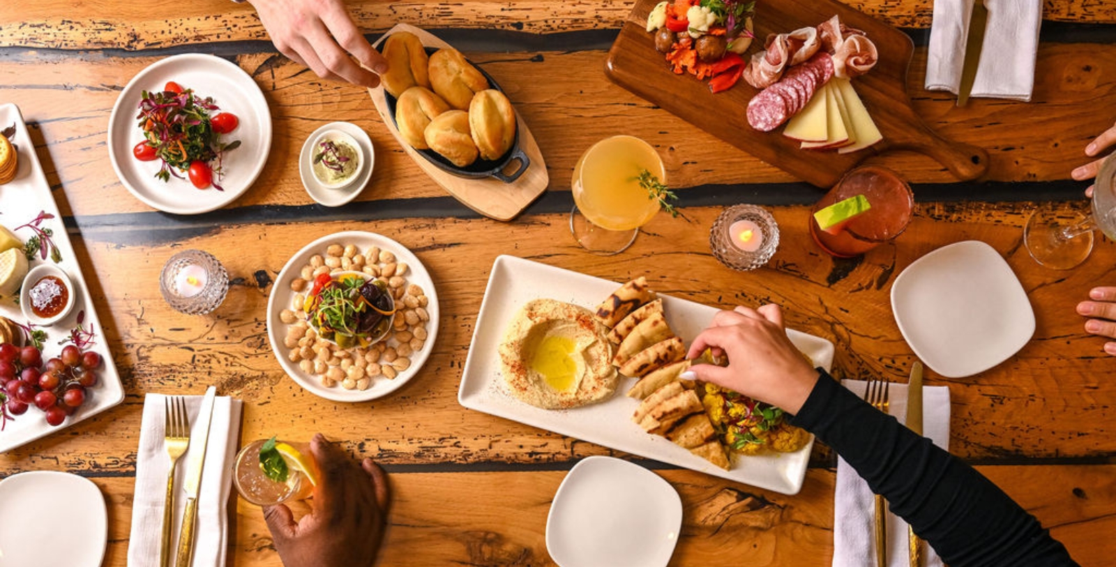 a group of people eating food at a table