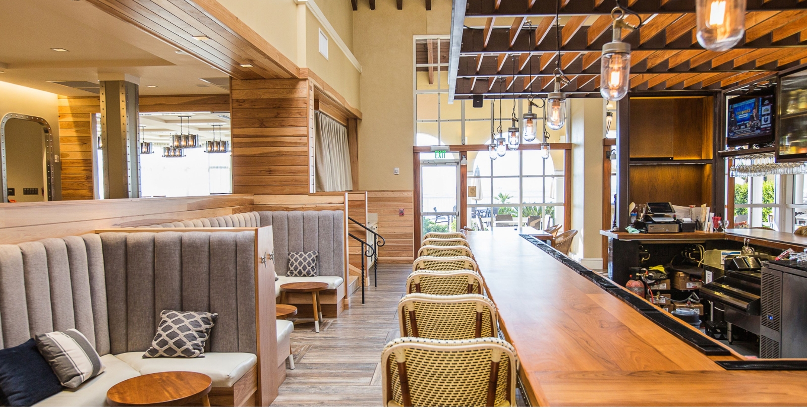 a restaurant with a long table and chairs